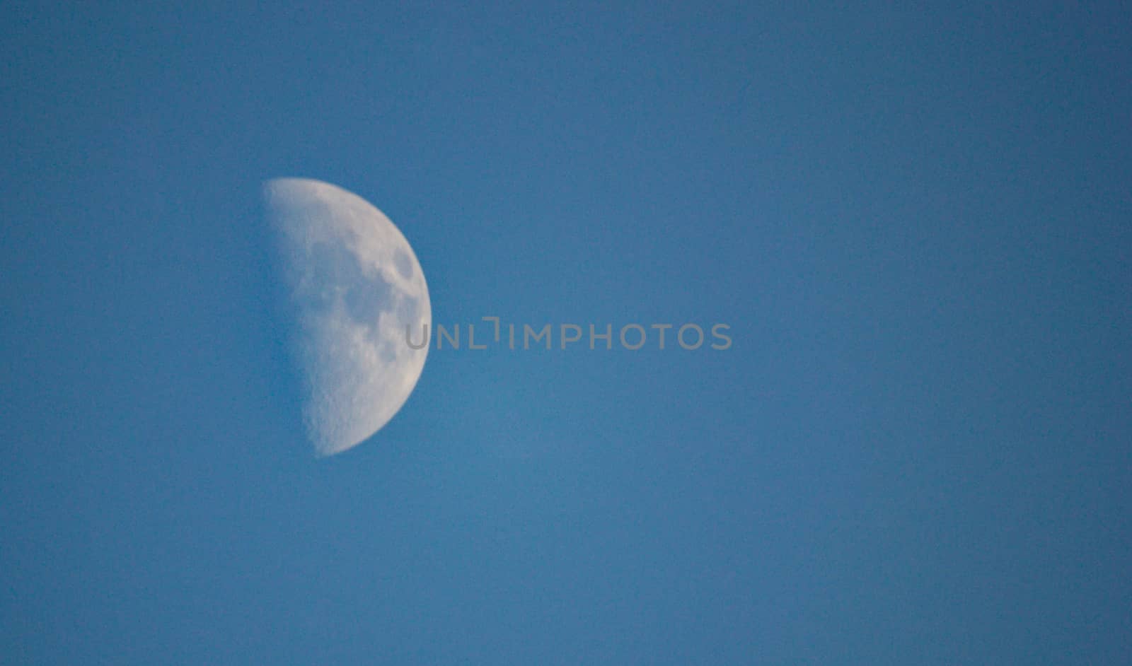 Paul moon blue sky daytime in the winter