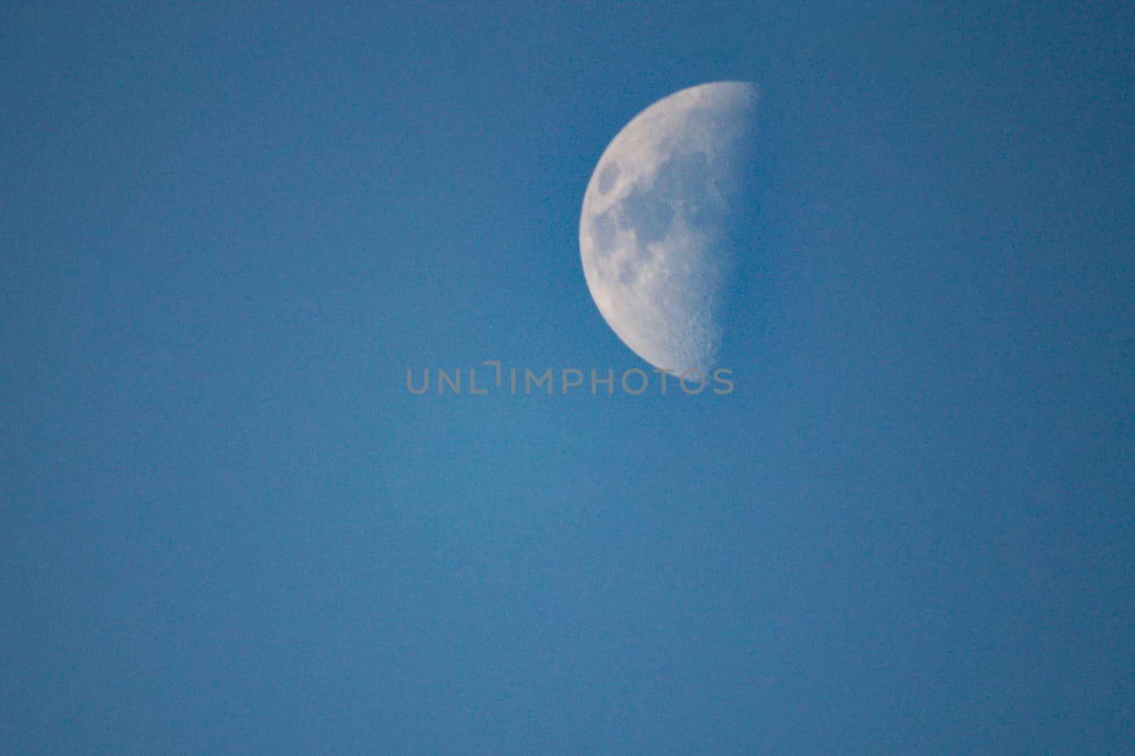 Paul moon blue sky daytime in the winter