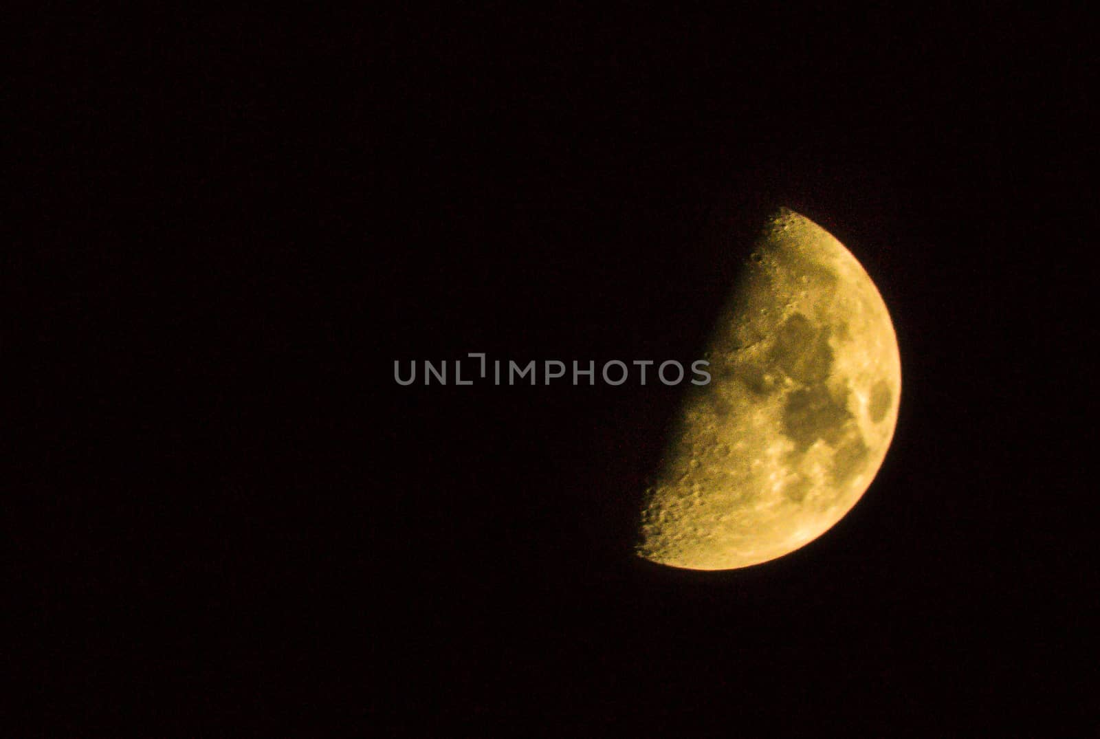 half of yellow moon night of Astro shooting the moon