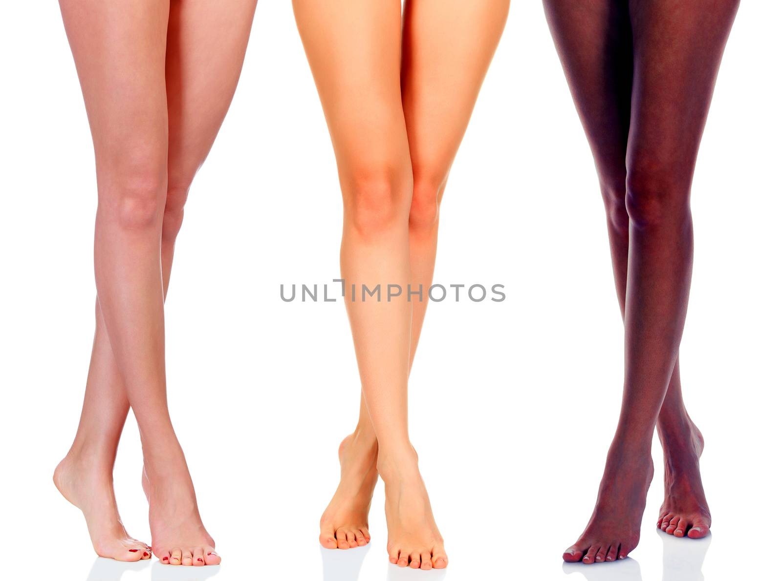 Long woman legs of black and caucasian girls isolated on white background