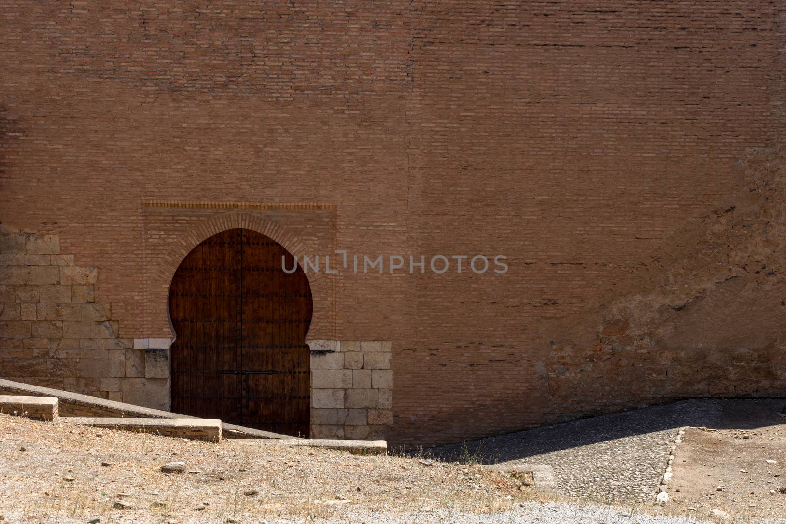 Moorish Islamic Arch above a wooden door in Granada, Spain, Euro by ramana16