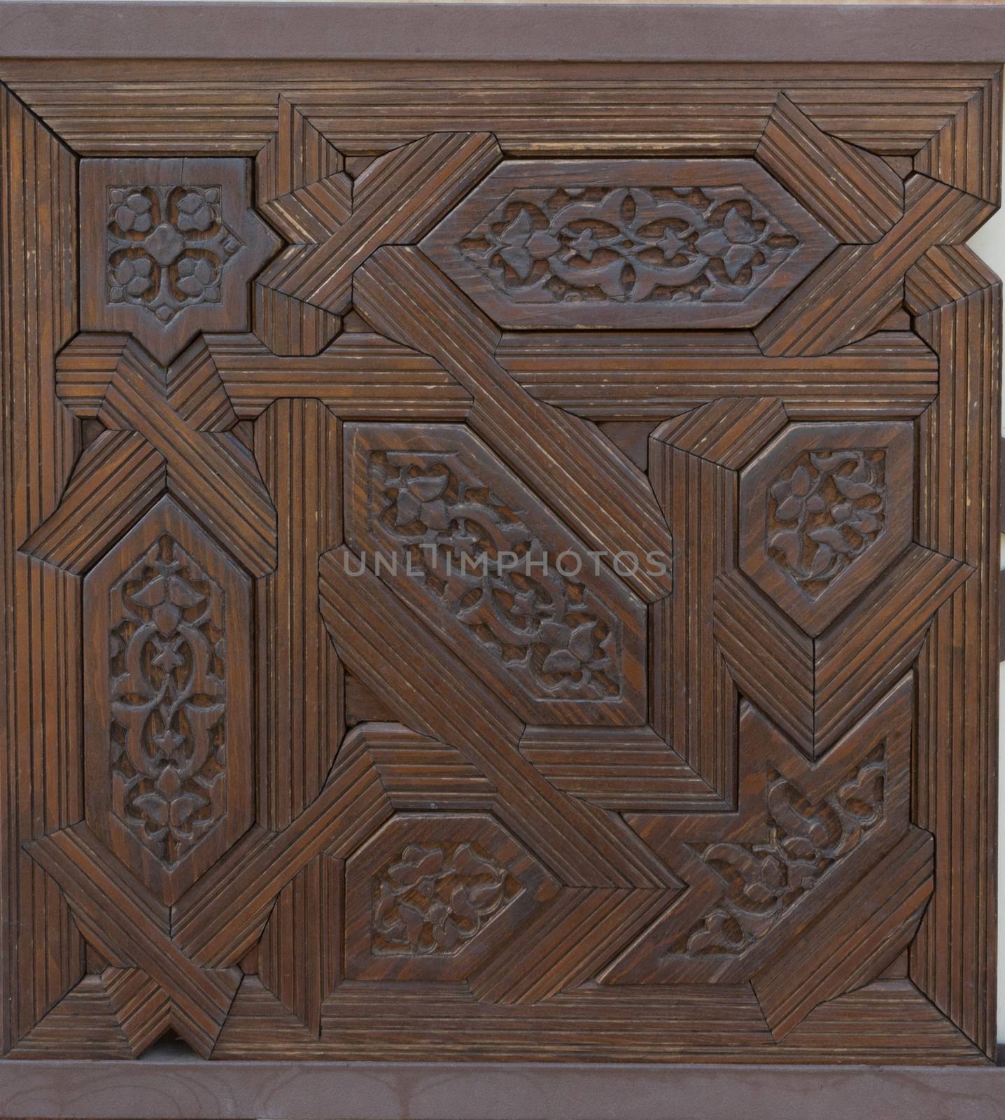 closeup of a wall of wood with arabic design in Alhambra, Granada, Spain, Europe on a bright summer day