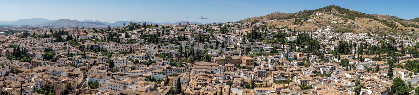 Panorama Aerial view of the city of Granada, Albaycin , viewed from the Alhambra palace in Granada, Spain, Europe on a bright summer day with blue sky