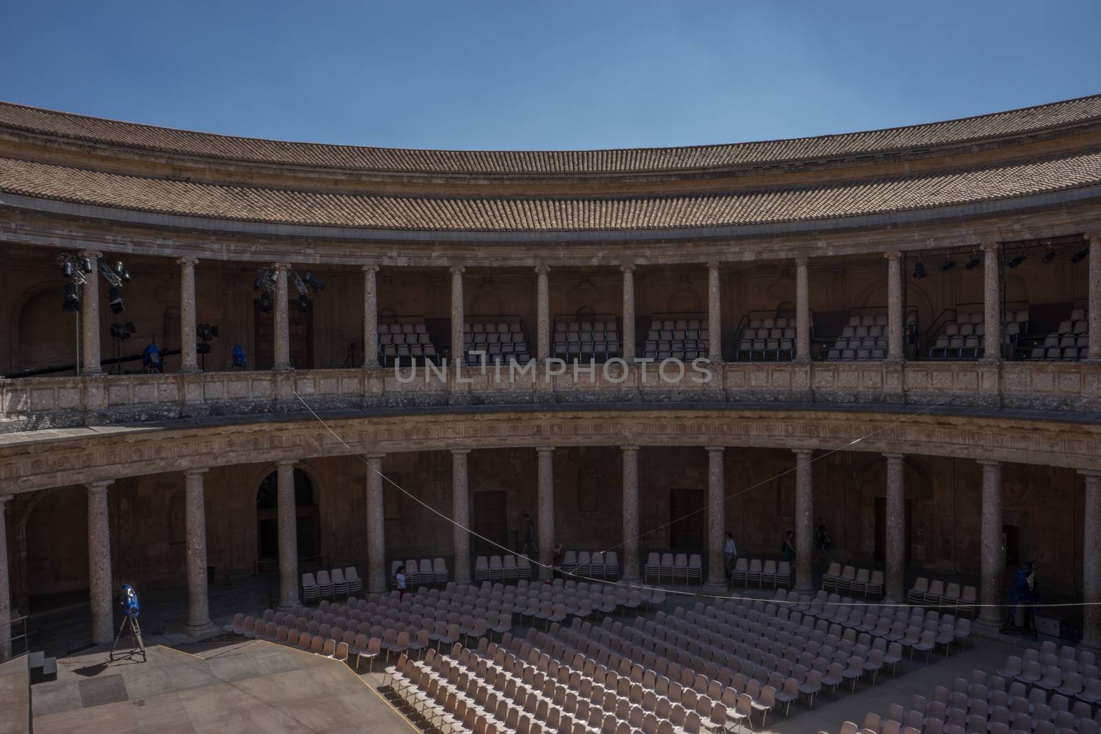 The Colosseum, columns and atrium of Alhambra palace, Granada, Spain, Europe on a bright sunny summer day with clear blue sky