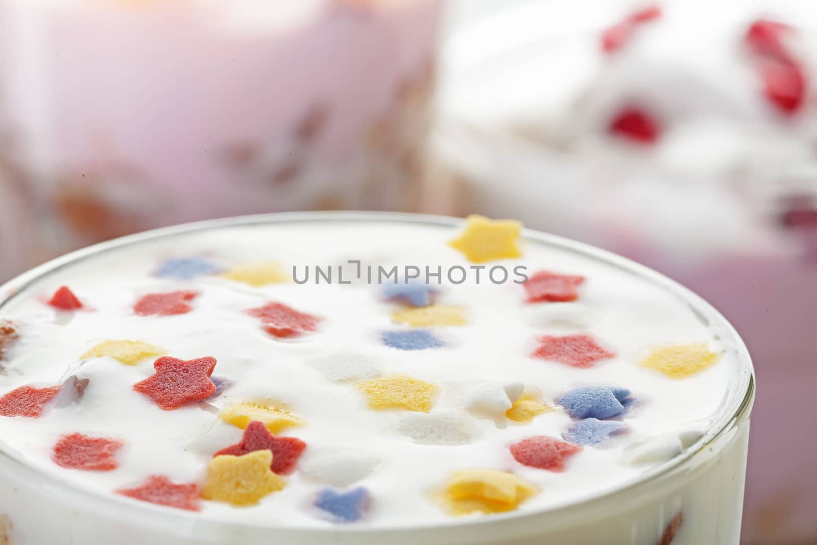 Natural homemade yogurt decorated with multicolored stars