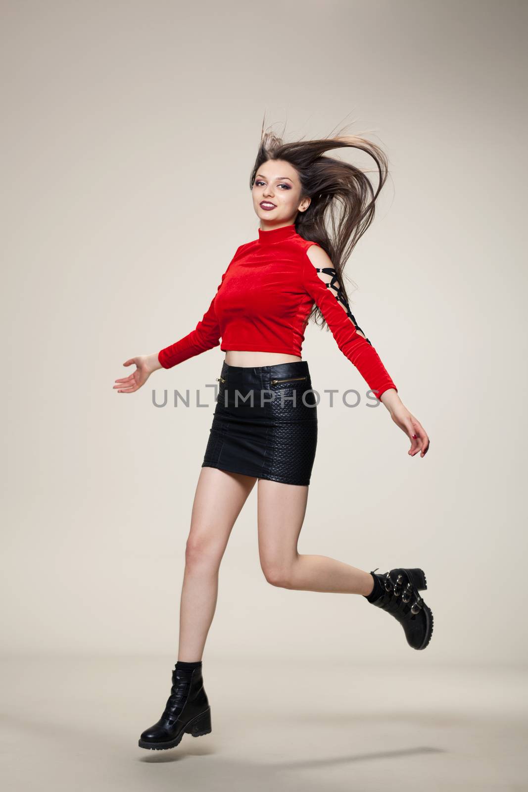 girl jumping in studio by kokimk