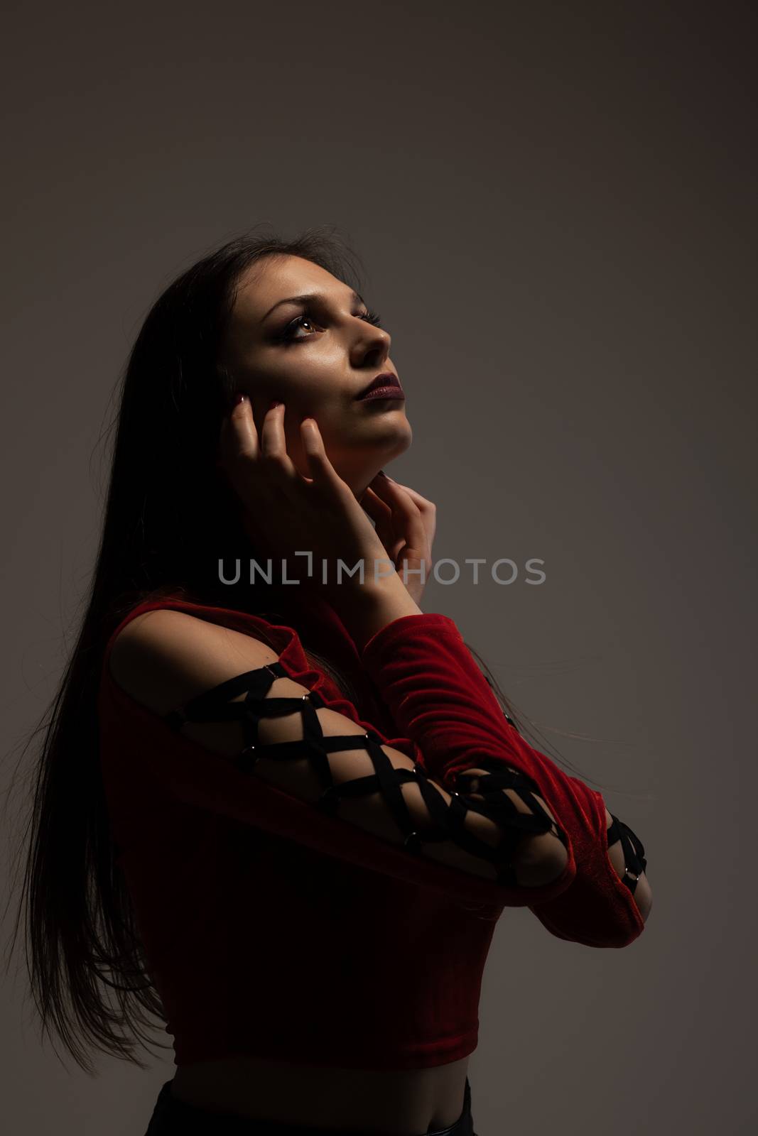 gothic style girl in red shirt, looking up