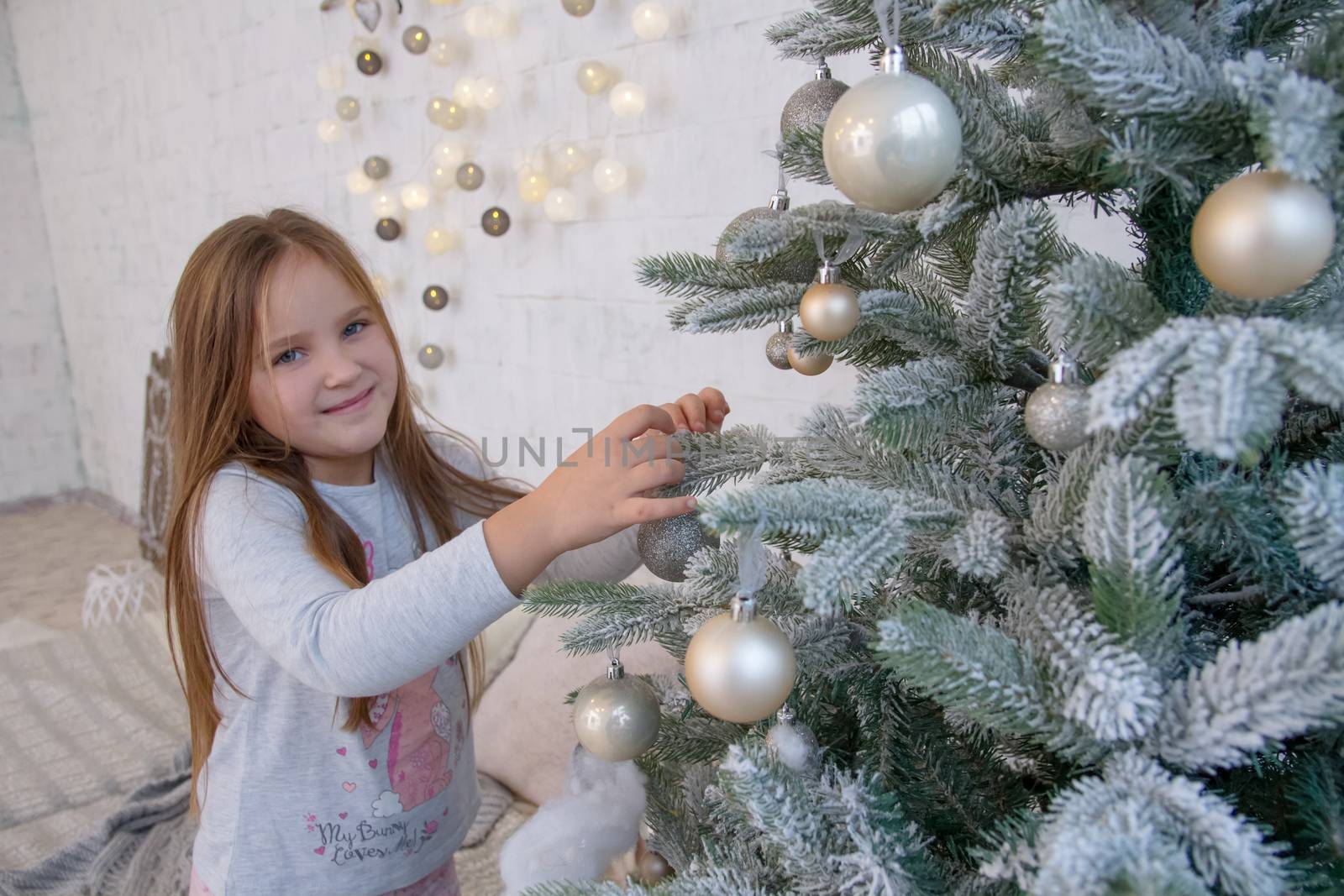 Girl decorating Christmas tree by Angel_a