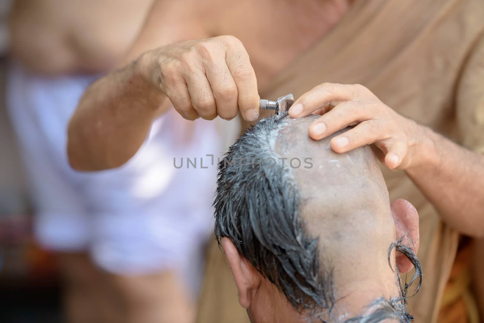 Thailand Culture with Shaved head man for Buddha.