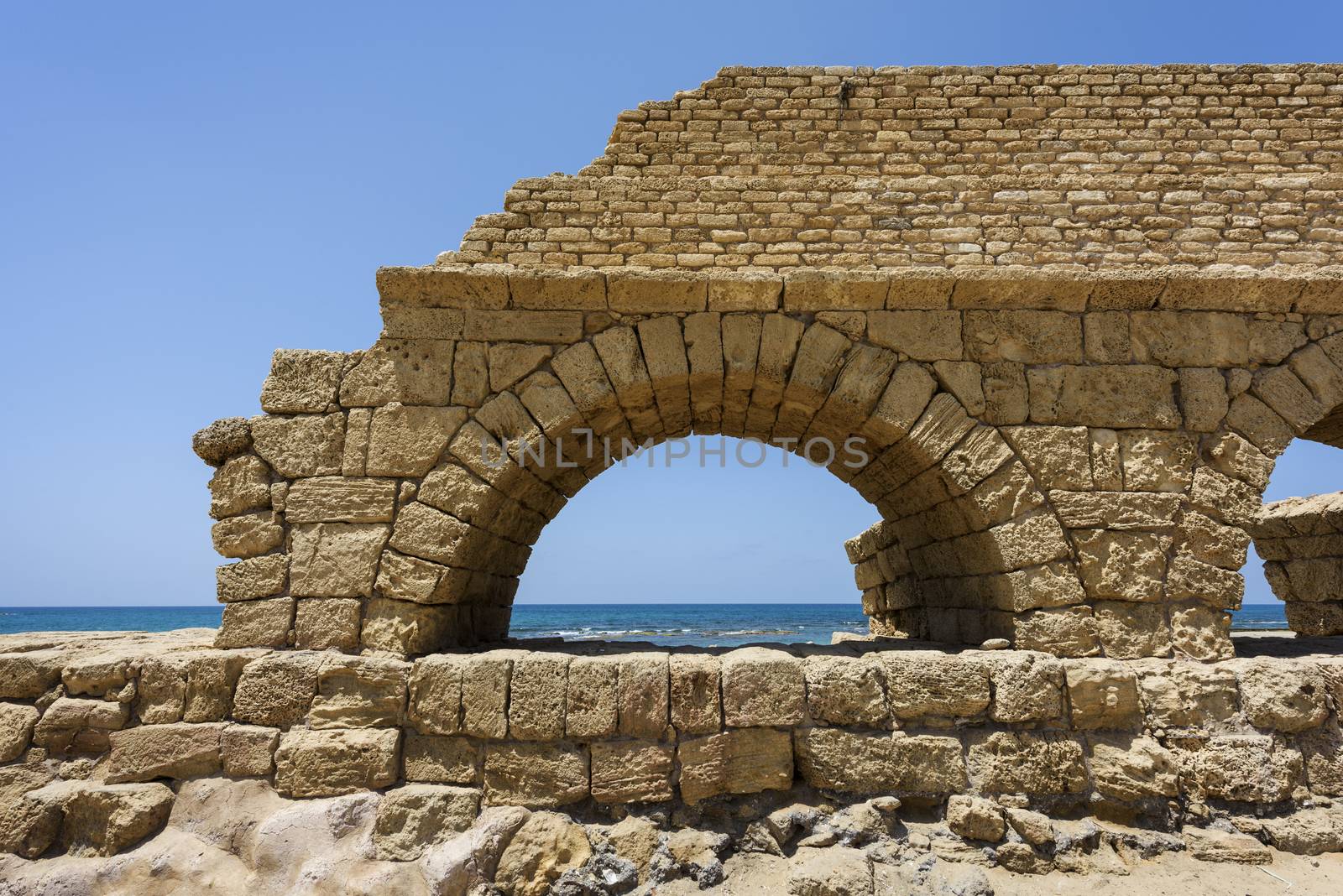 Ancient Roman aqueduct in Ceasarea at the coast of the Mediterranean Sea, Israel built by Herod, Israel