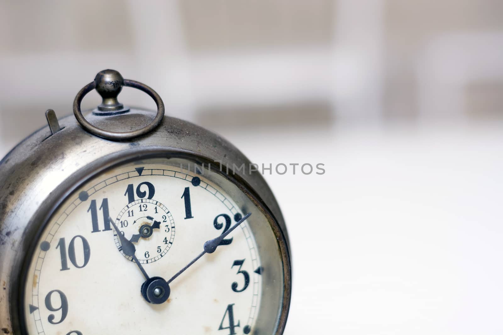 old clock on a white background. Interior shot. Nobody