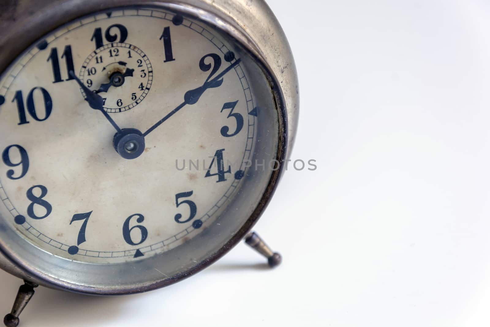 old clock on a white background. Interior shot. Nobody