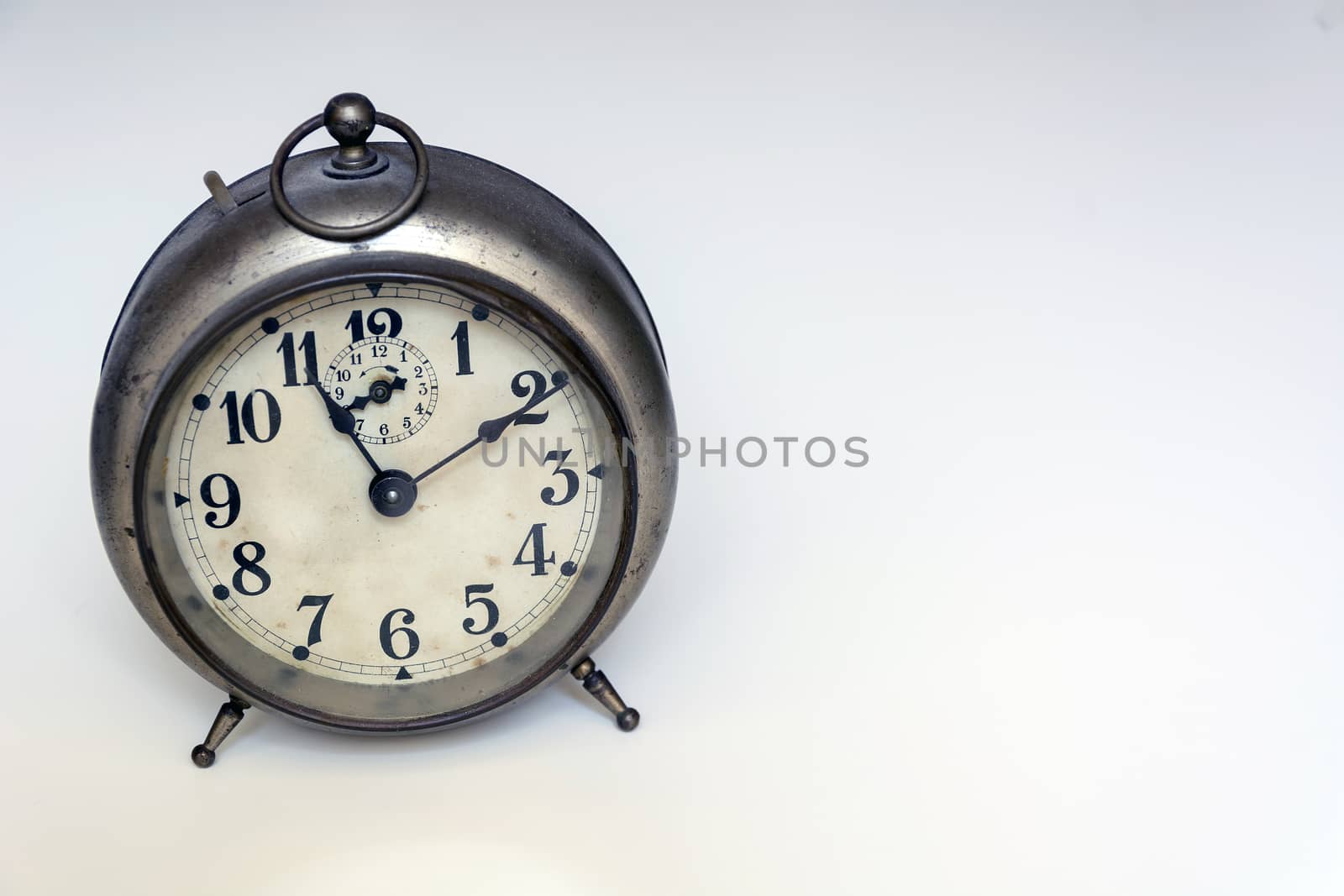 old clock on a white background. Interior shot. Nobody