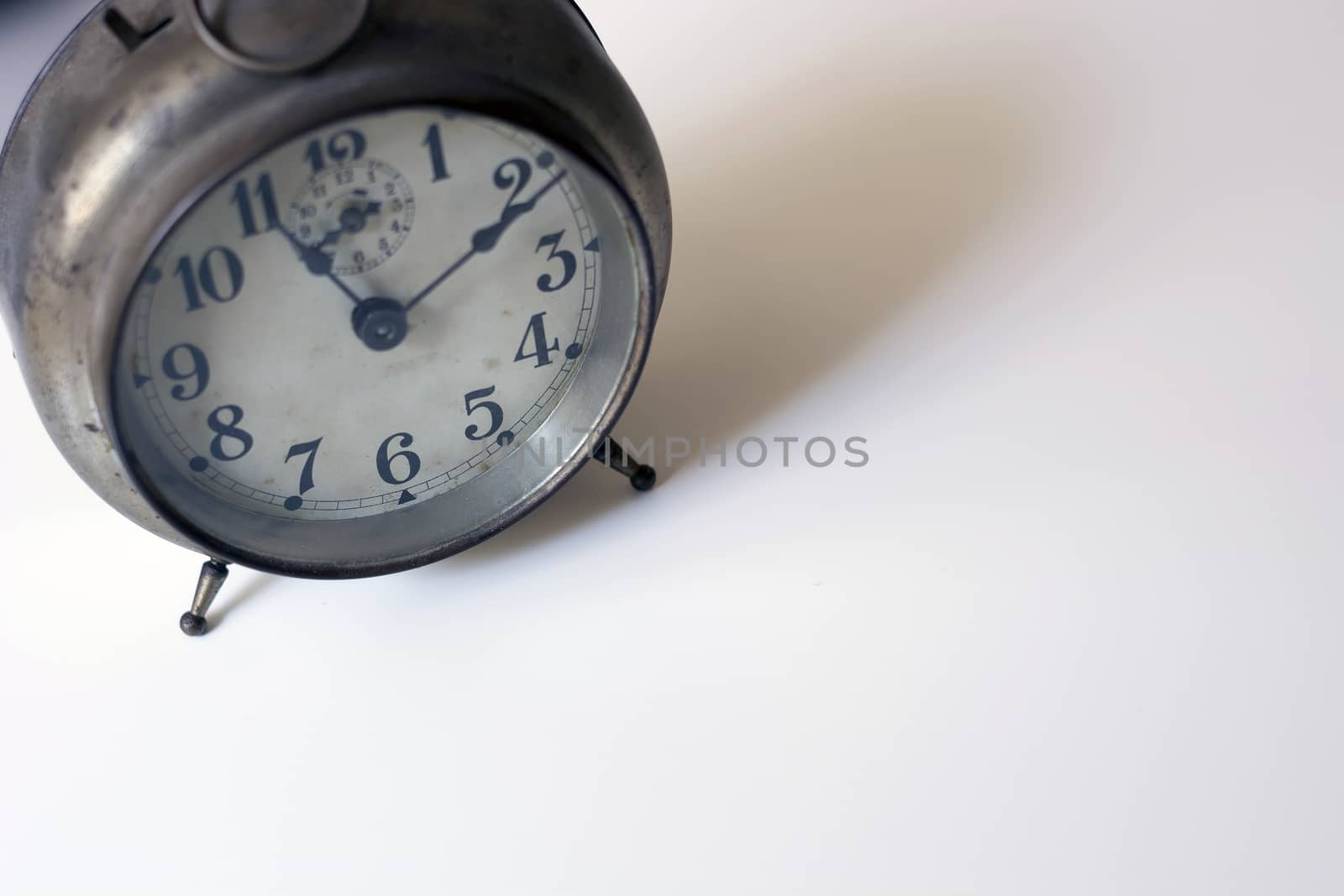 old clock on a white background. Interior shot. Nobody