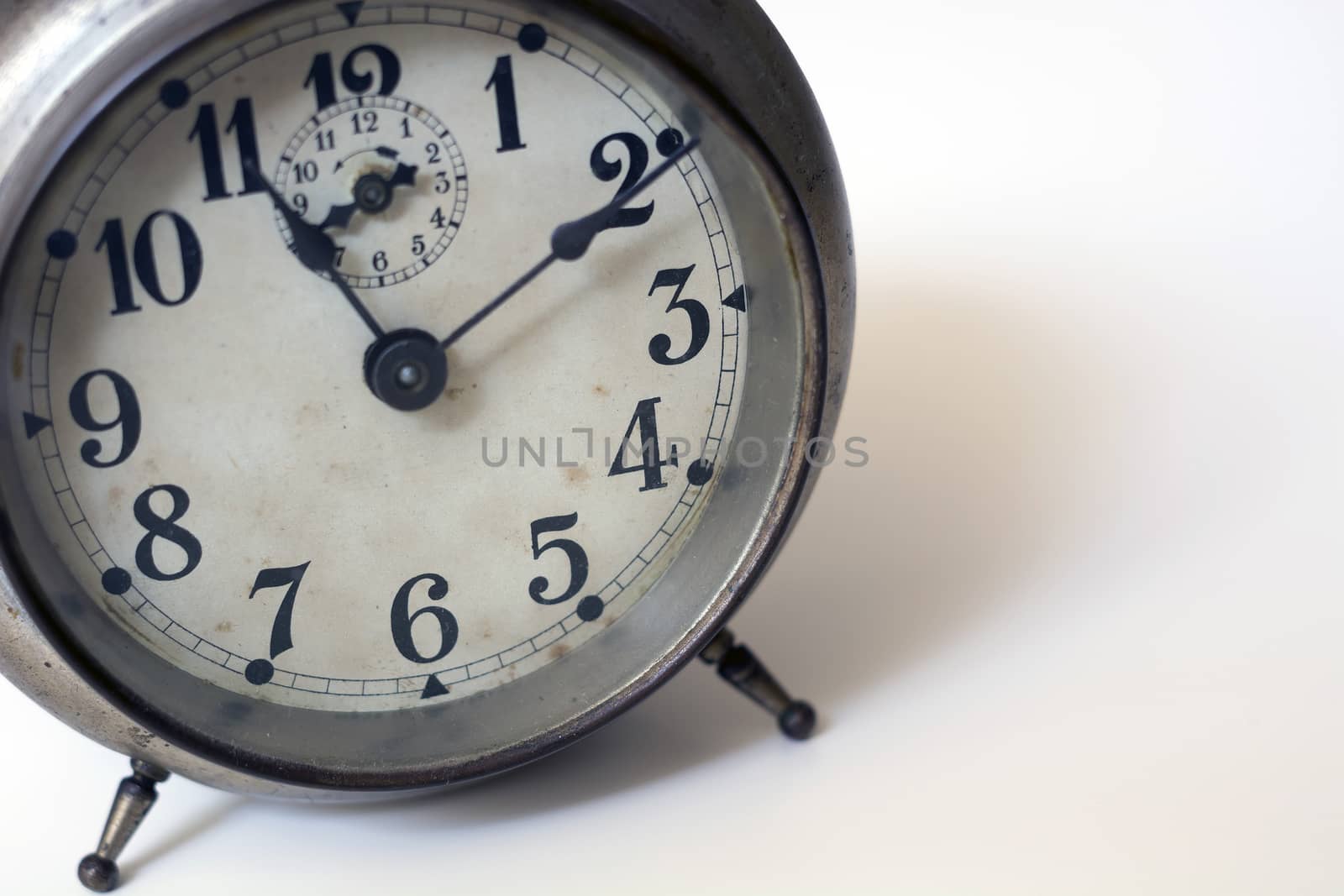 old clock on a white background. Interior shot. Nobody