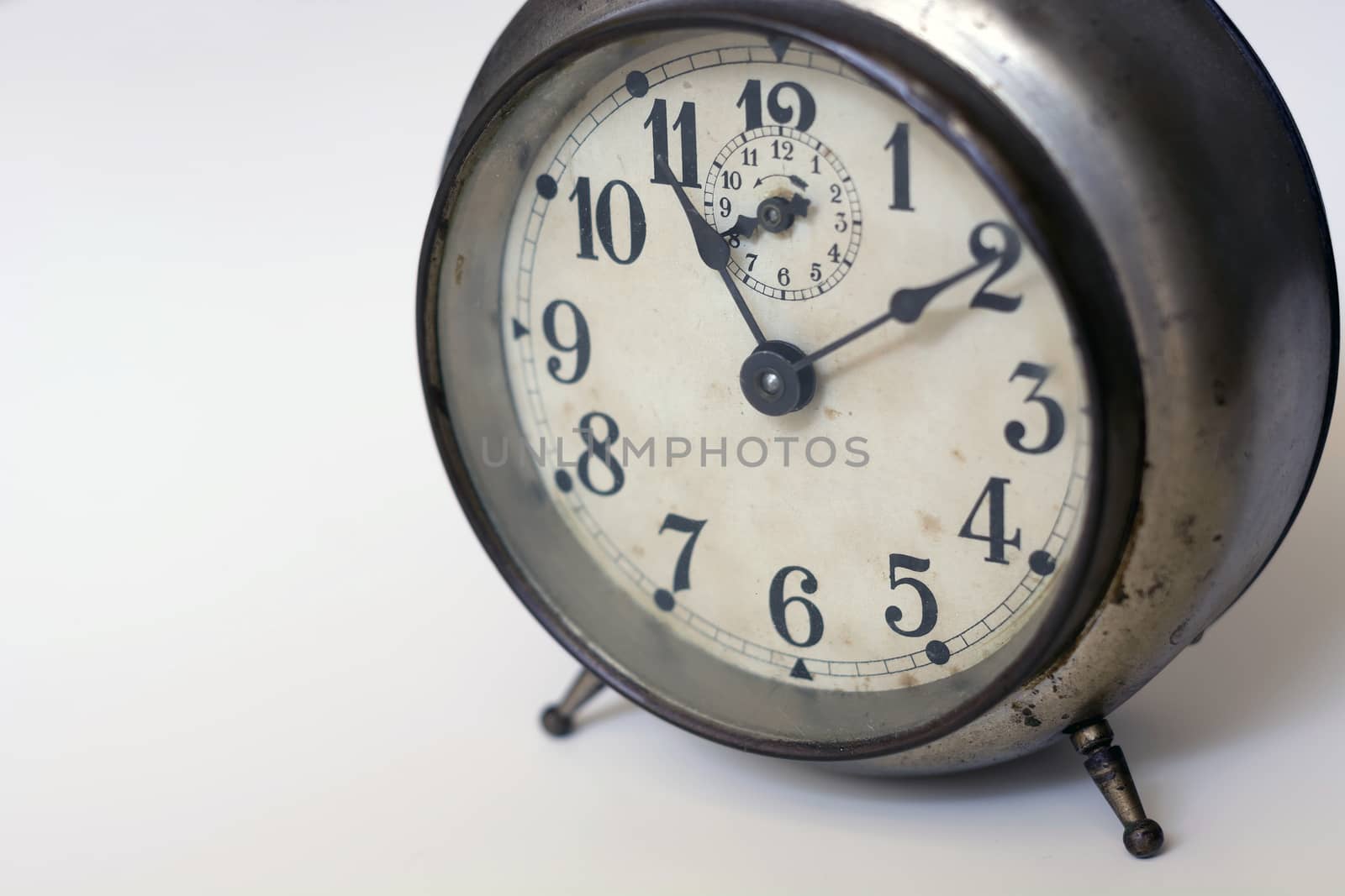 old clock on a white background. Interior shot. Nobody