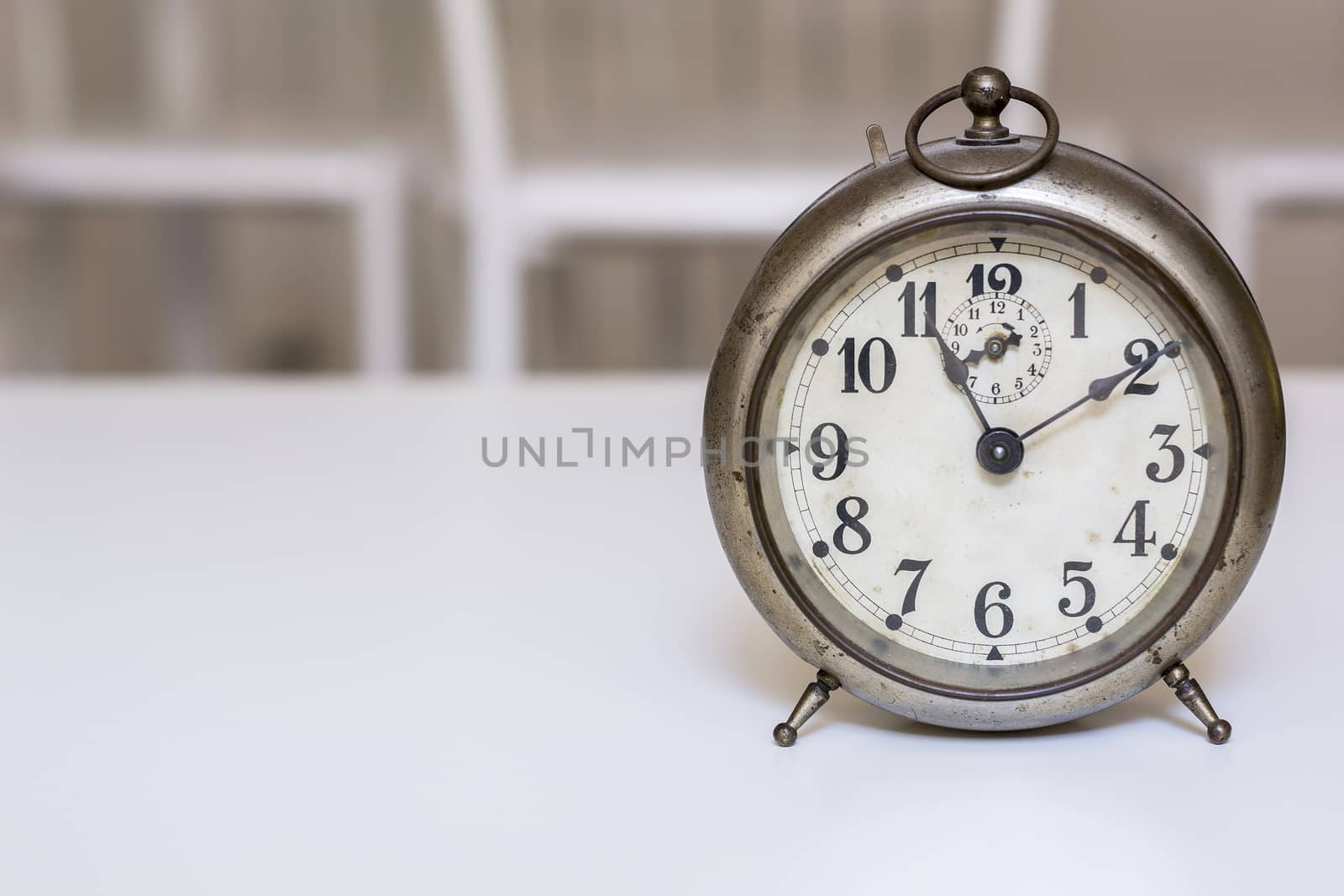 old clock on a white background. Interior shot. Nobody