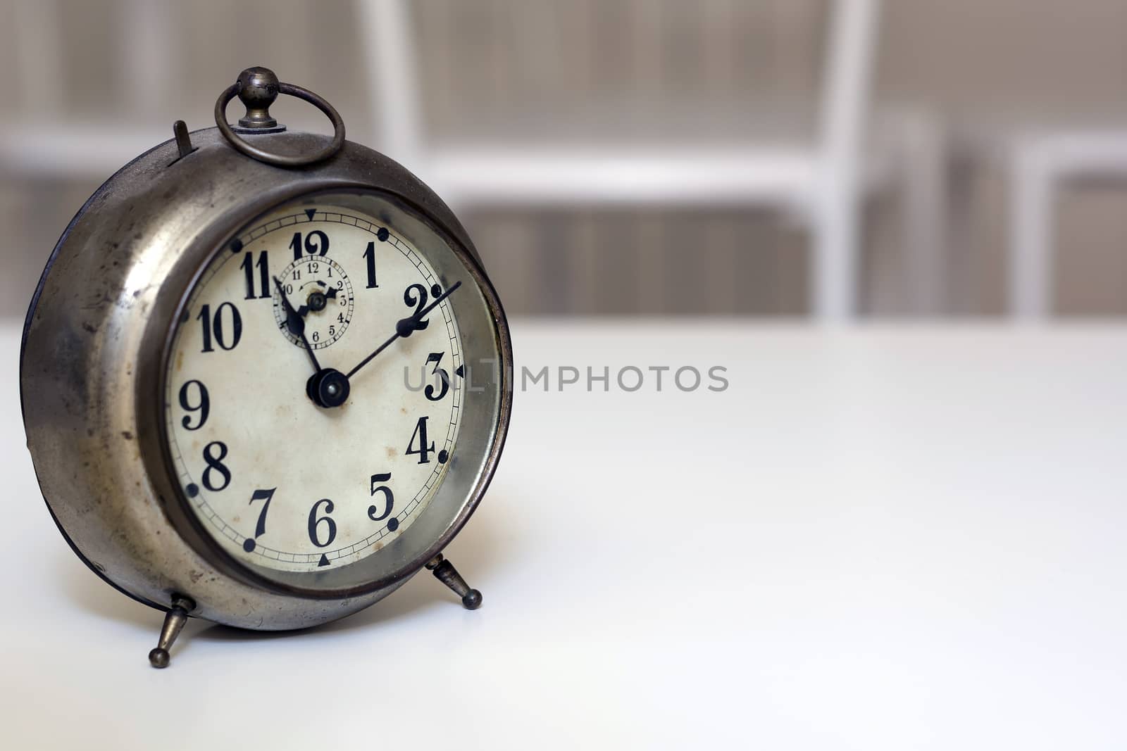 old clock on a white background. Interior shot. Nobody
