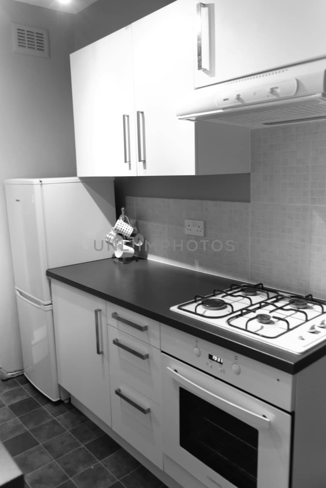 Nice kitchen in English appartment, white cabinets by Kasia_Lawrynowicz