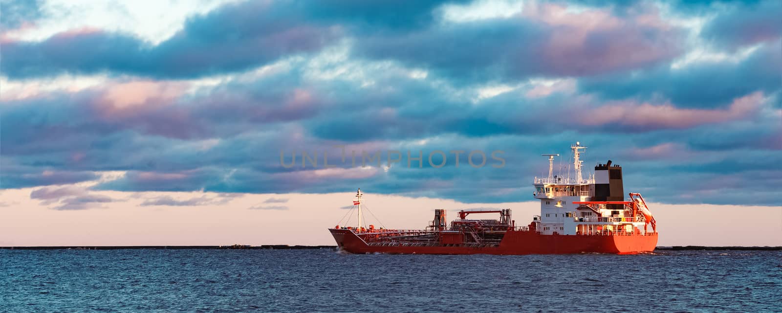 Red cargo oil tanker moving to Baltic sea
