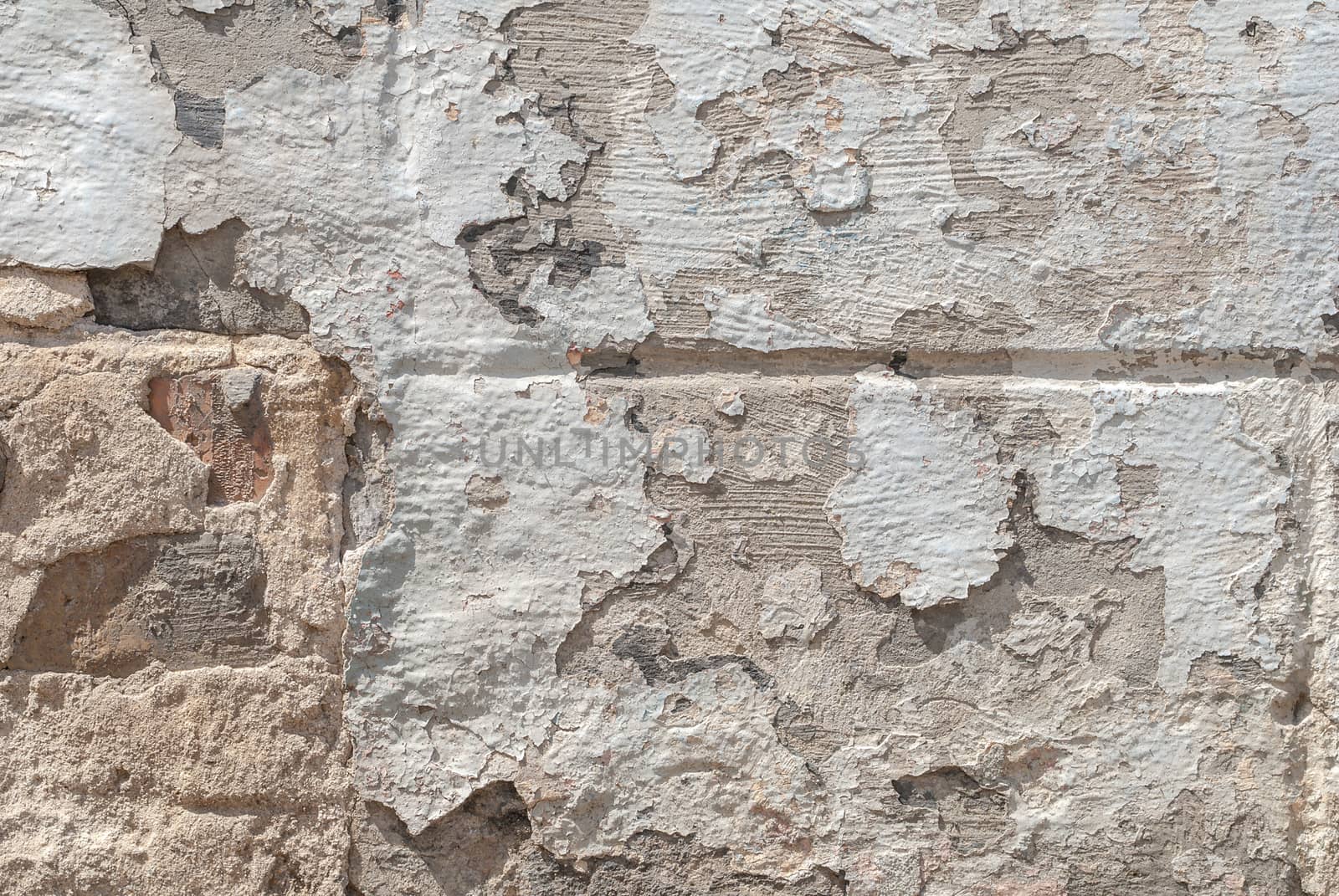 grey texture, old chipped plaster on the concrete wall, background by uvisni