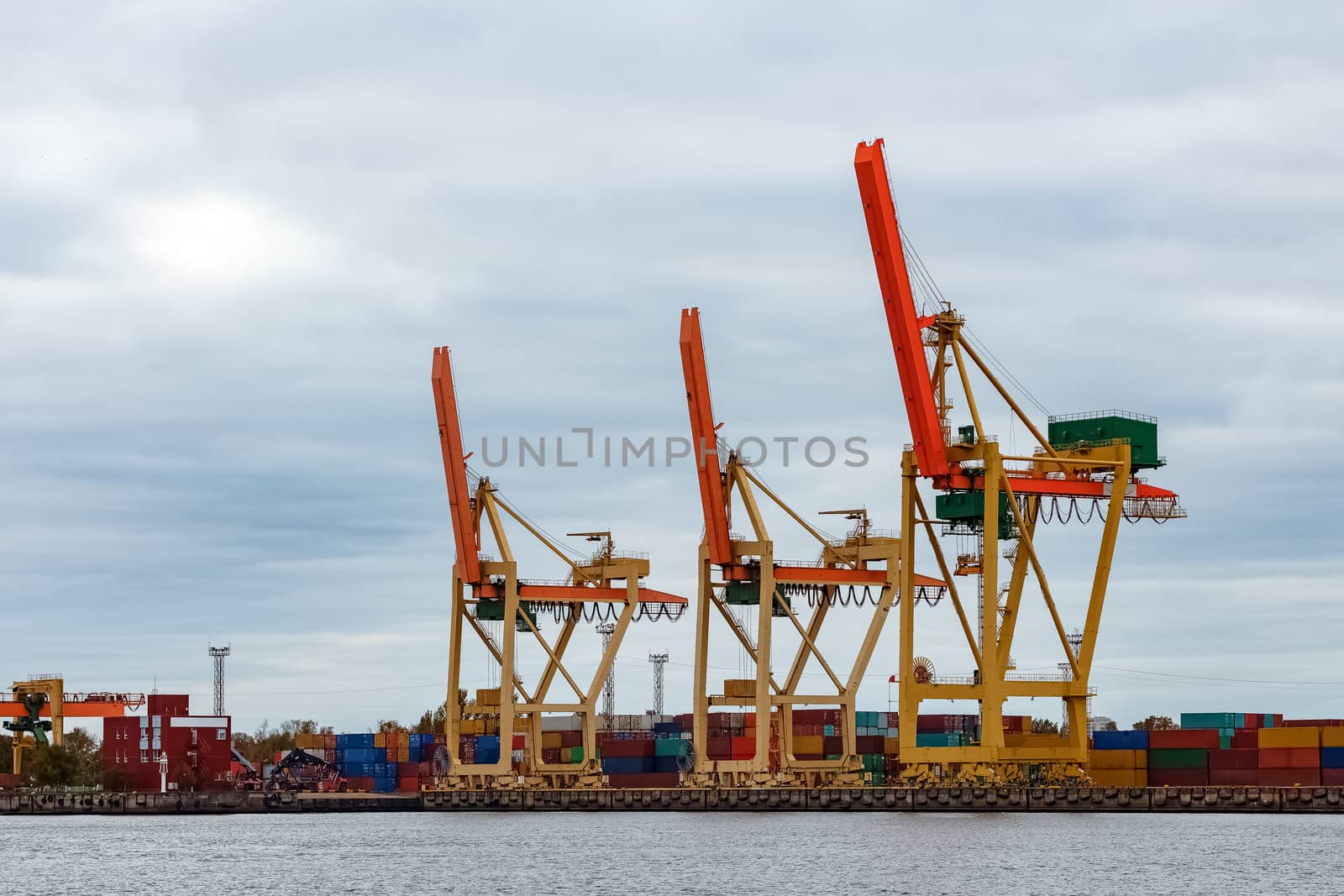 Yellow cargo cranes in the port of Riga, Europe