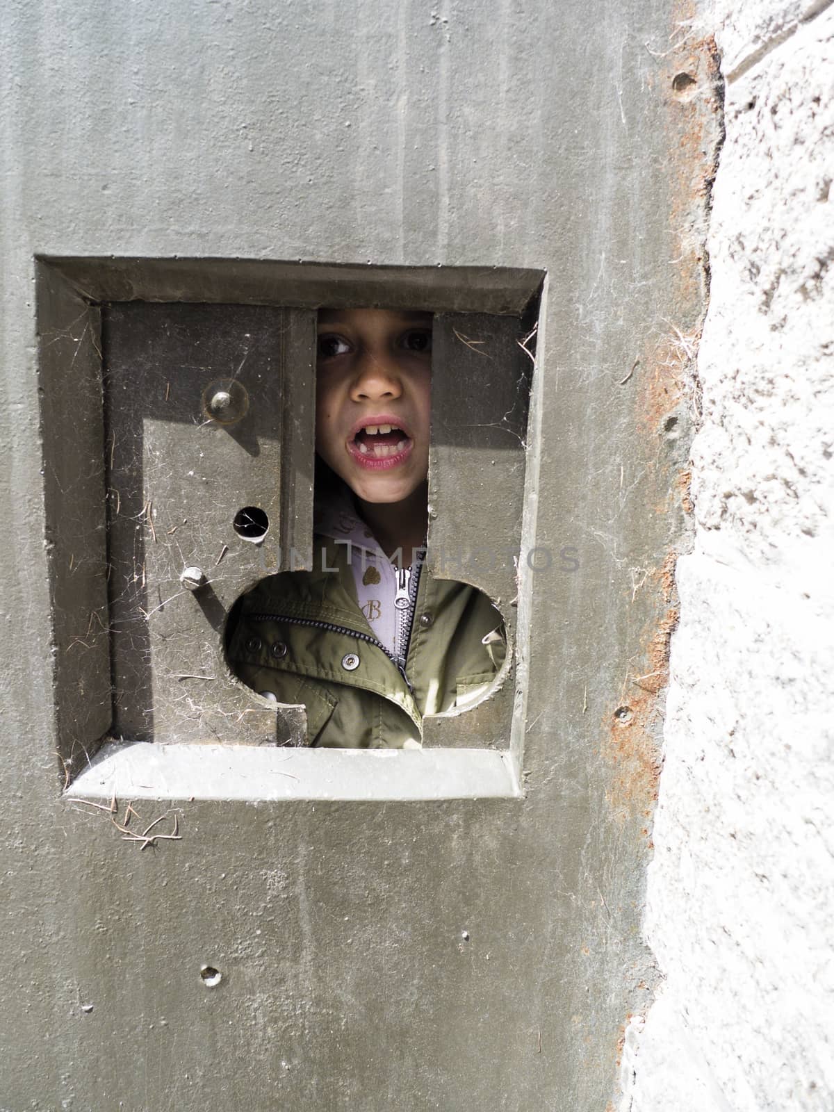 portrait of a little girl inside a fort from the second world wa by struki