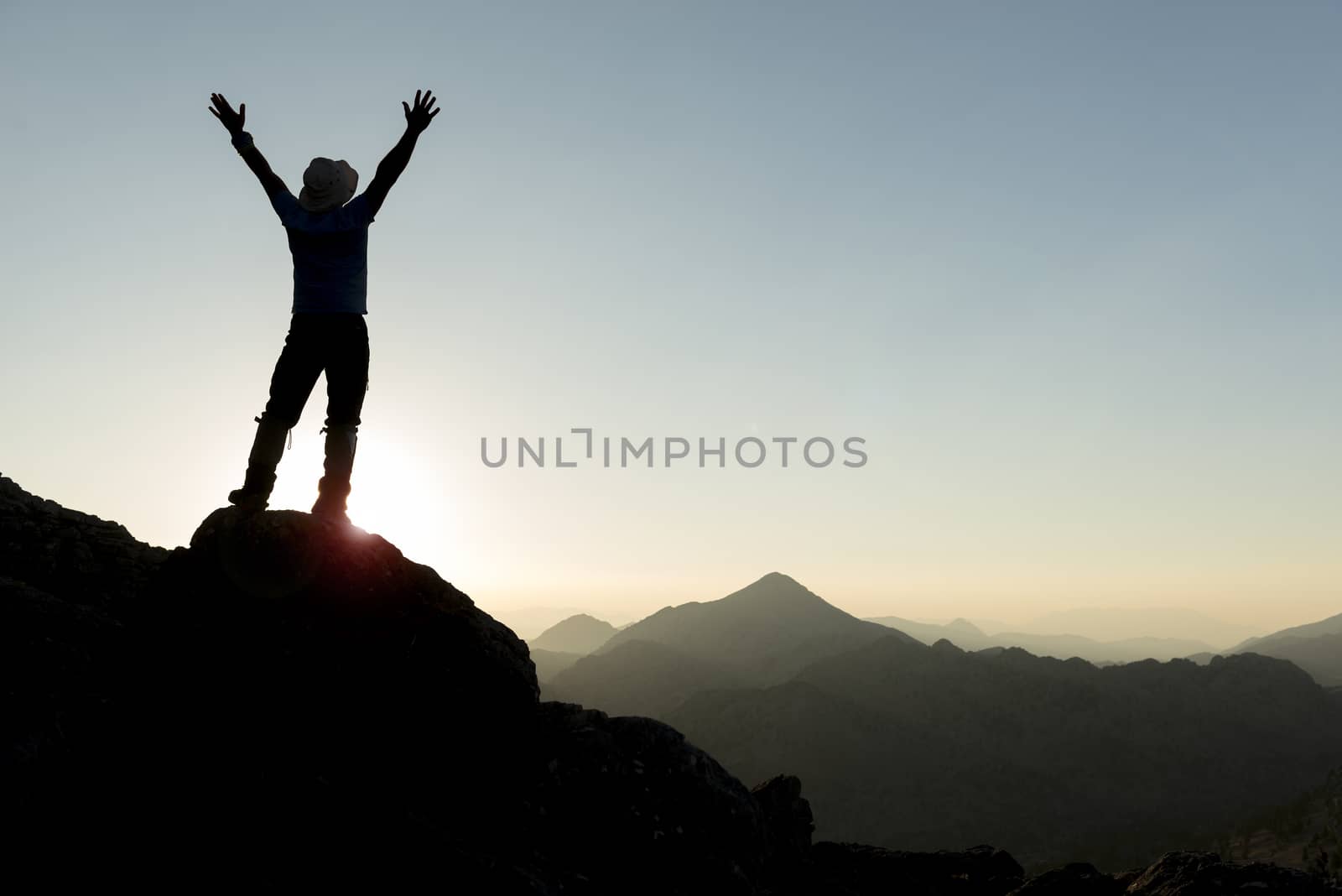 happiness of success at the peak of the mountains