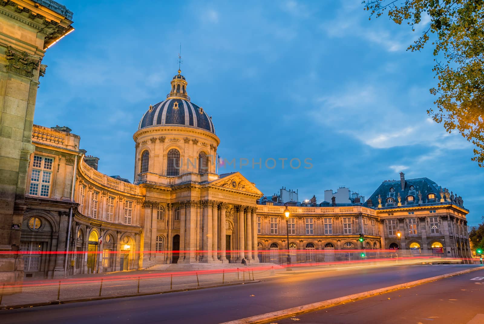 Institut de France in Paris at dusk and lights on