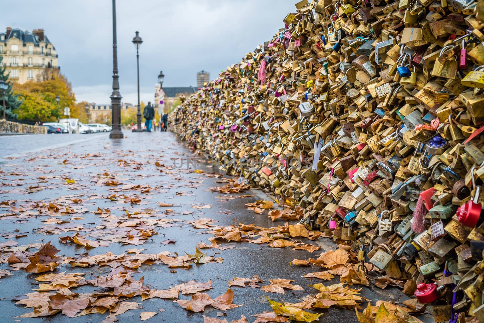 Love locks on Paris bridge in autumn