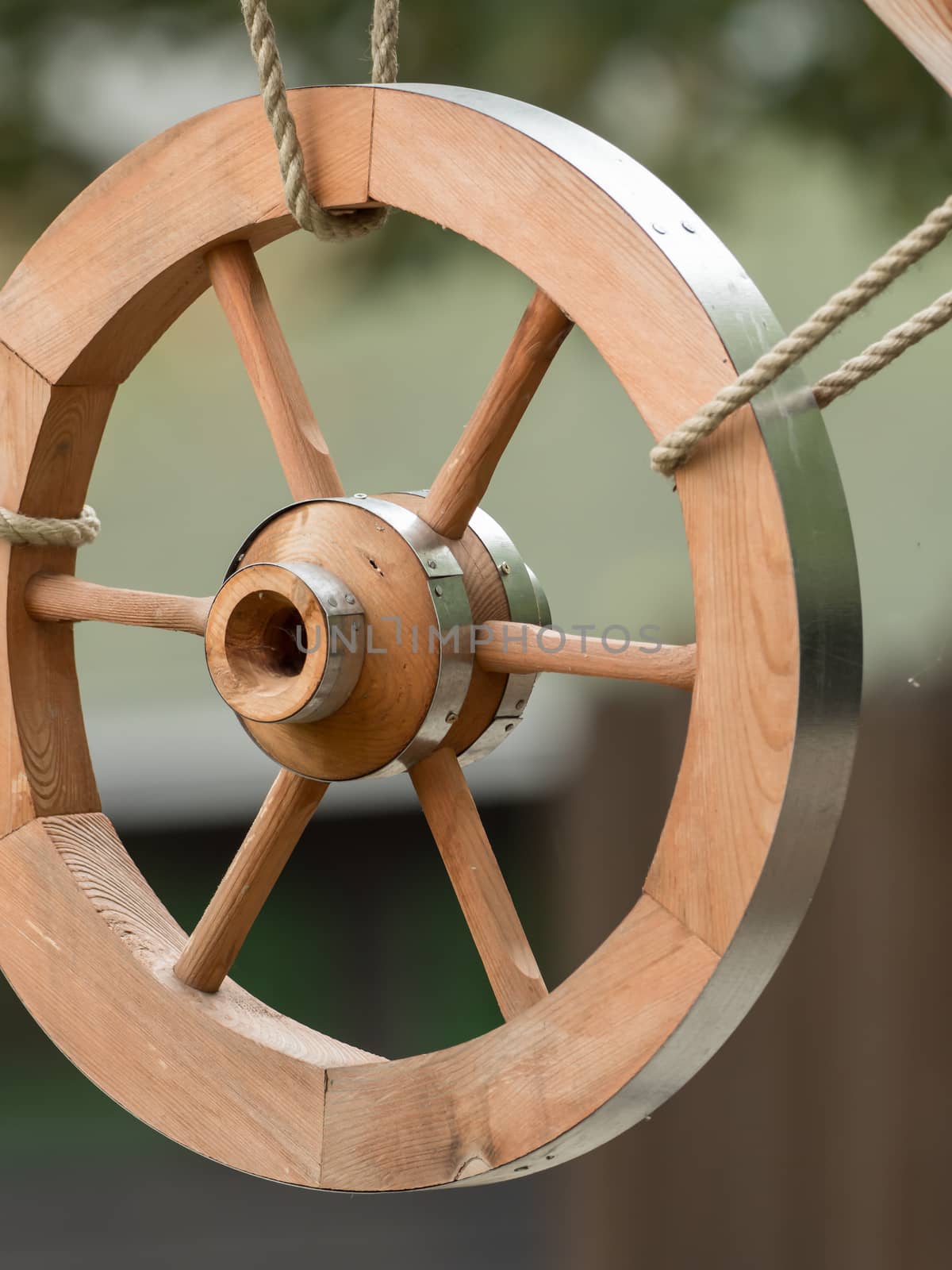 A wooden wheel hangs out as a decoration