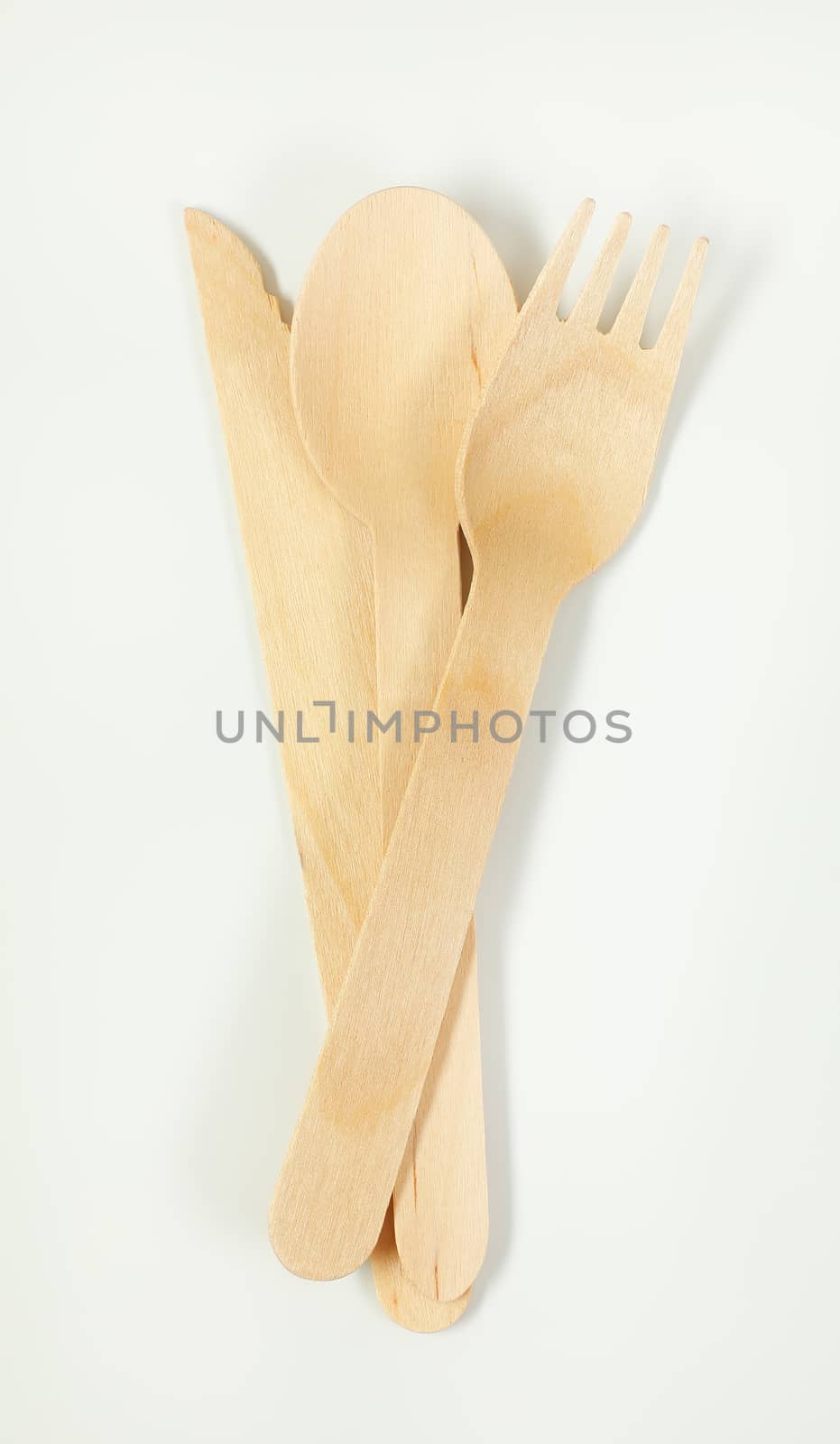 set of wooden cutlery on white background