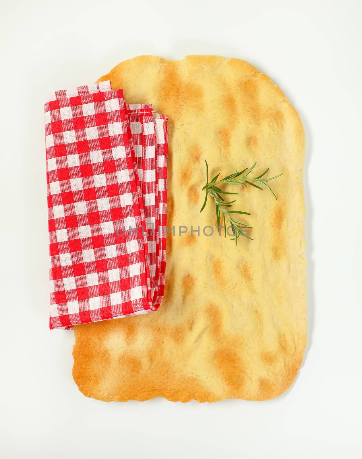cracker-like Italian flat bread made with white flour that is rolled into very thin sheets