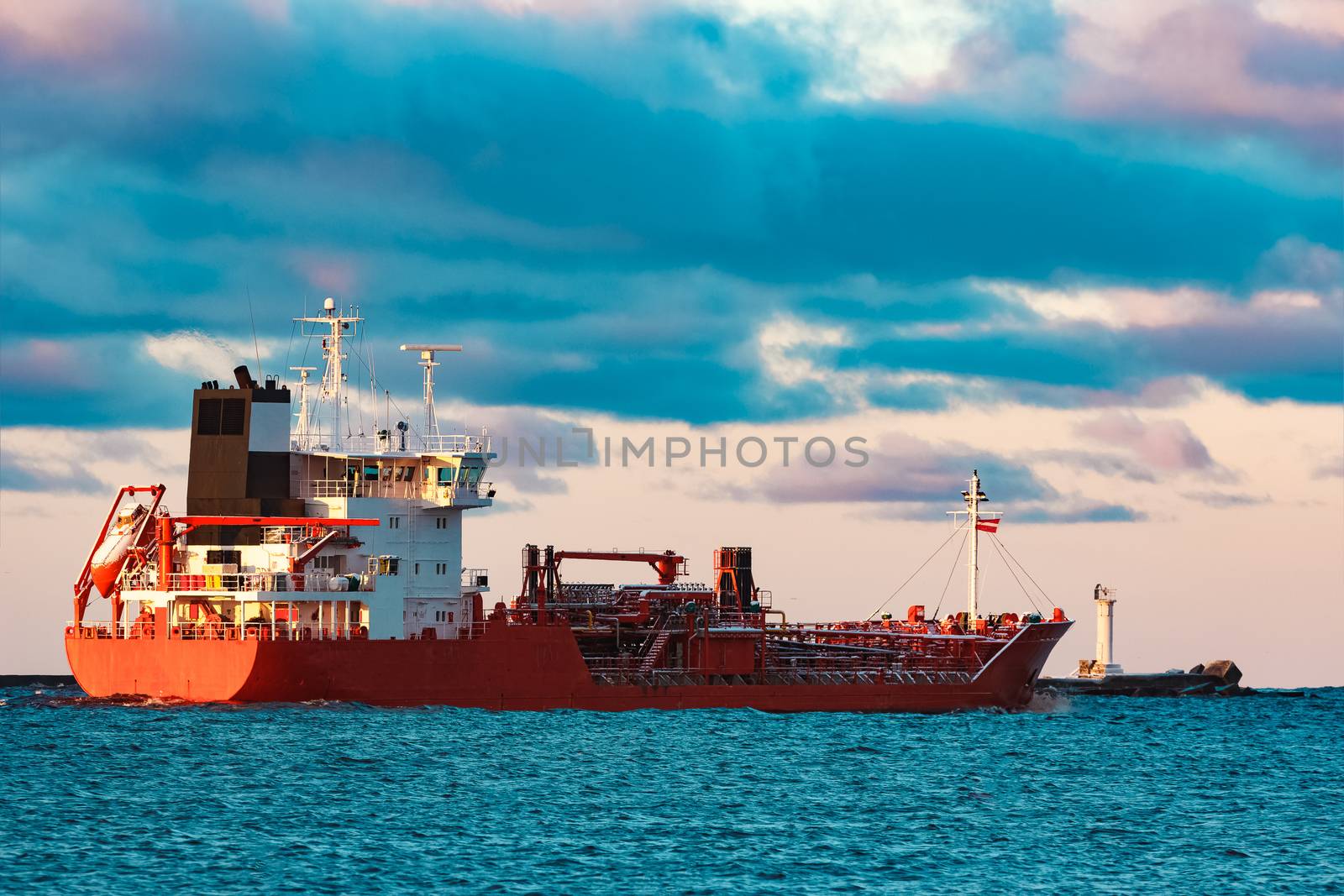 Red cargo oil tanker moving to Baltic sea