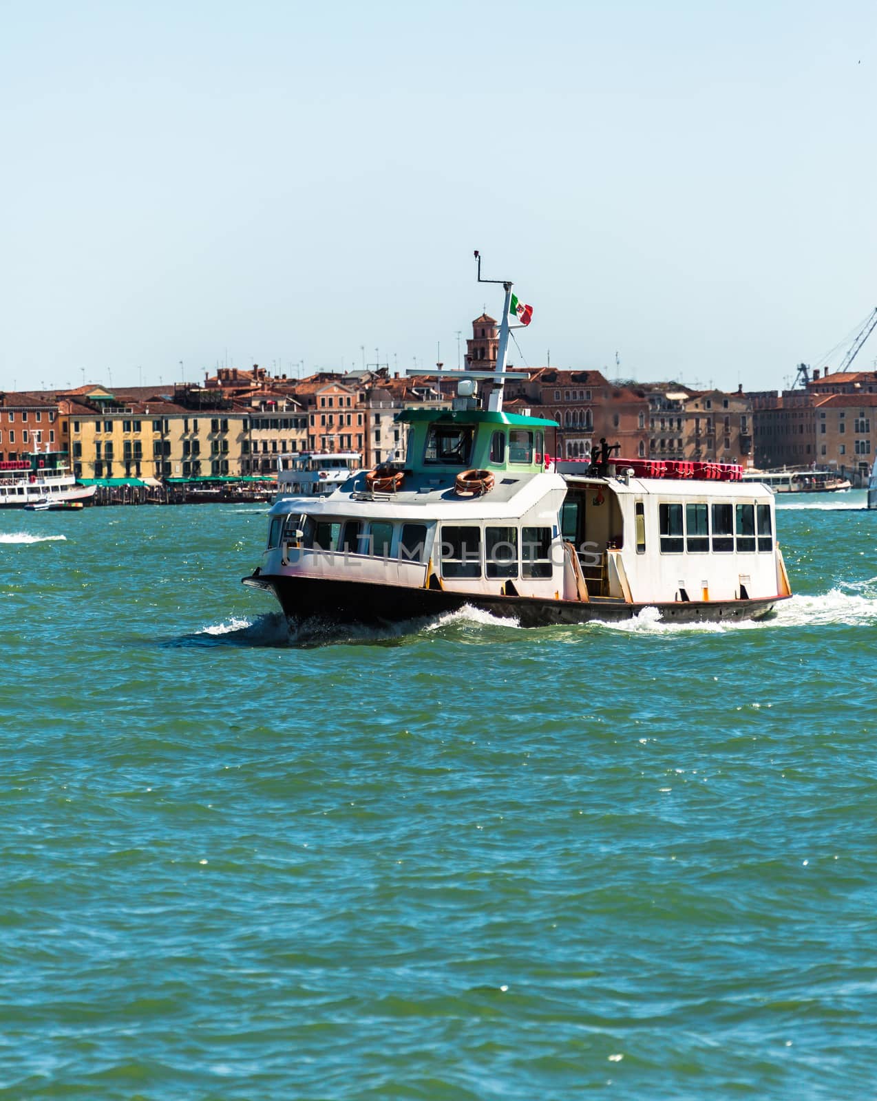  Boat floating from the island of San Giorgio, Venice, Italy
