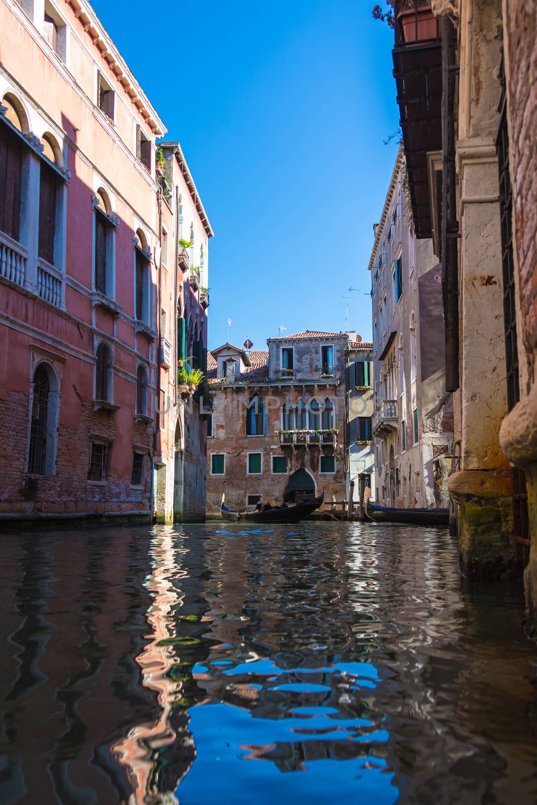 cityscape, floating gondola on Venice street, Italy