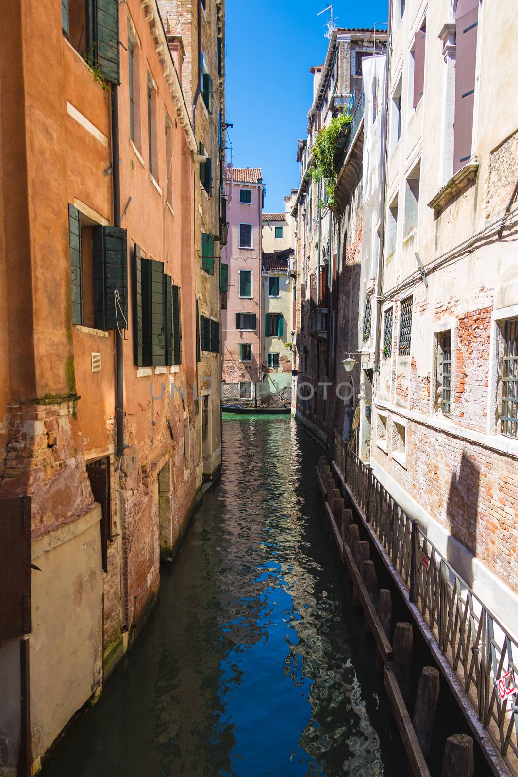 canal San Massimo runs among residential houses by MegaArt