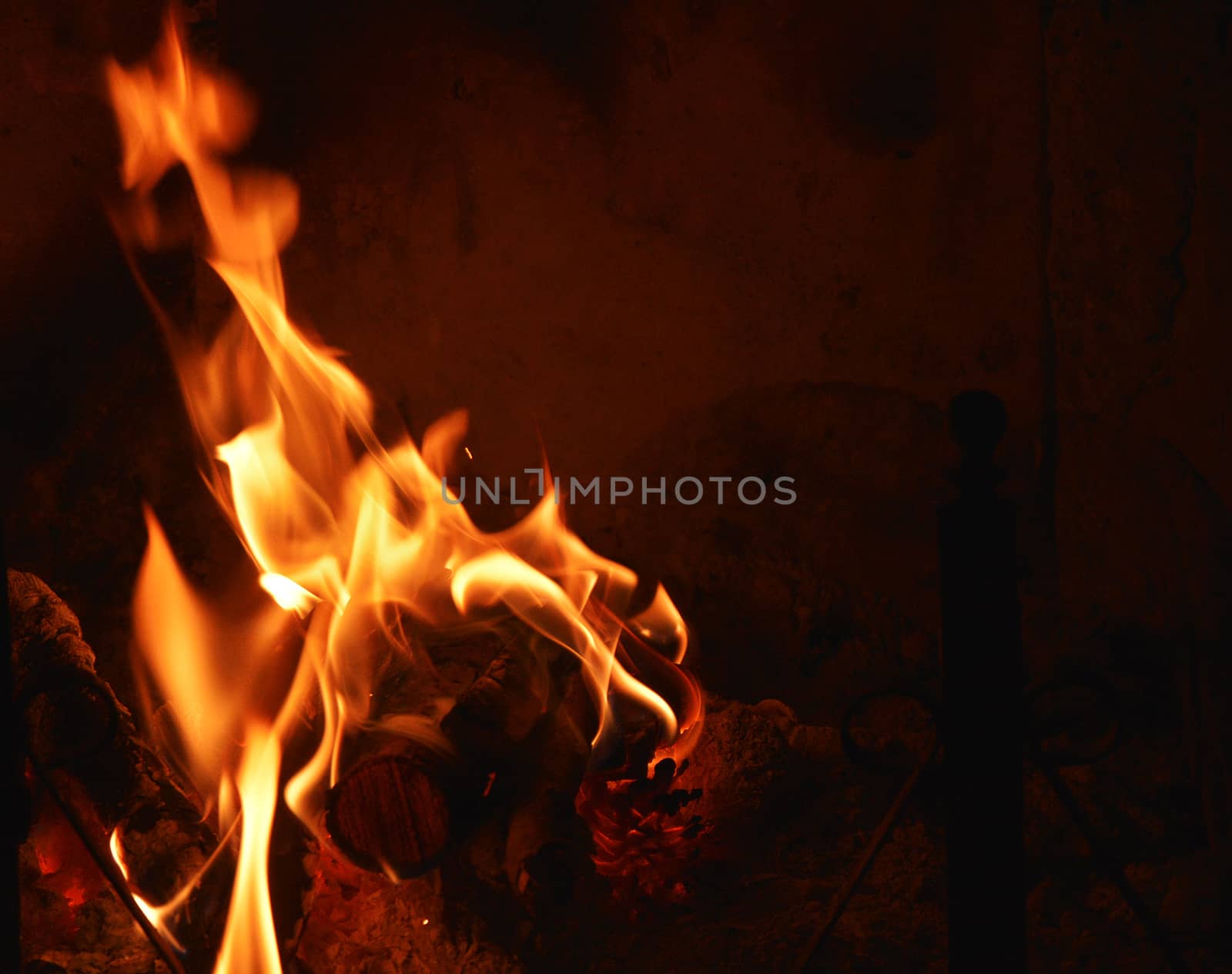 close-up view of warm fire burning in a fireplace