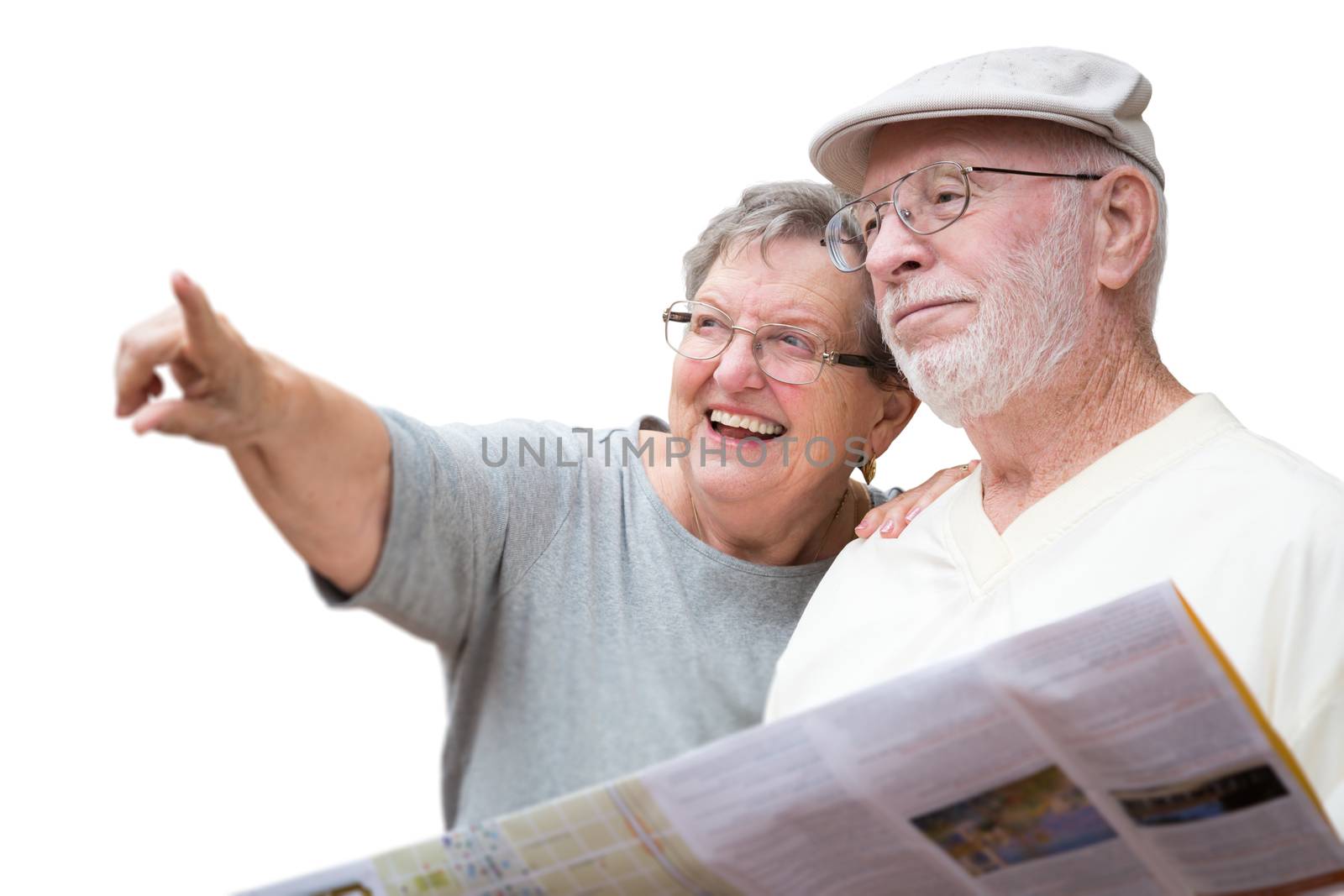 Happy Senior Adult Couple with Brochure Pointing Isolated on a White Background. by Feverpitched