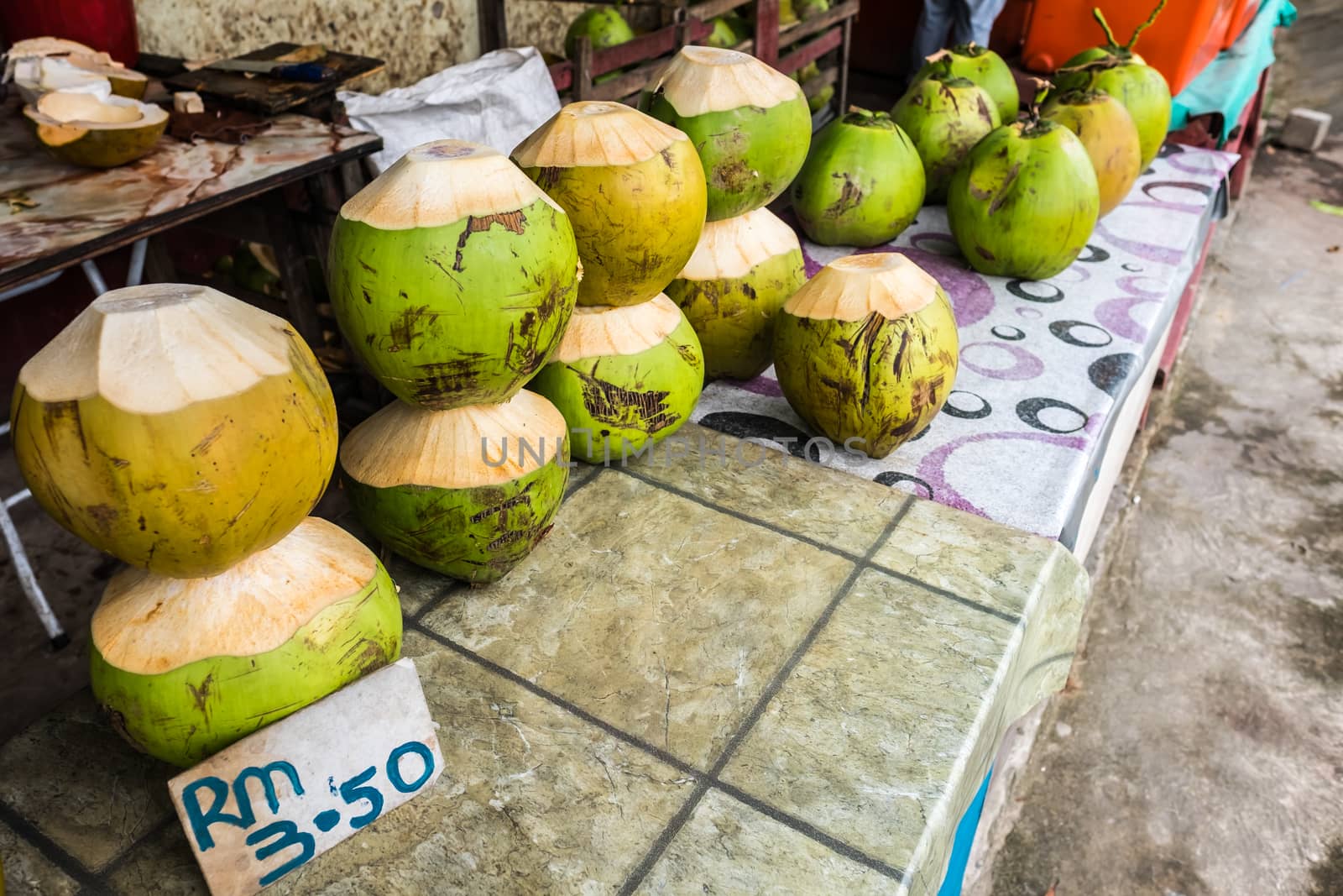 Fresh coconuts being sold at roadside stall in Borneo