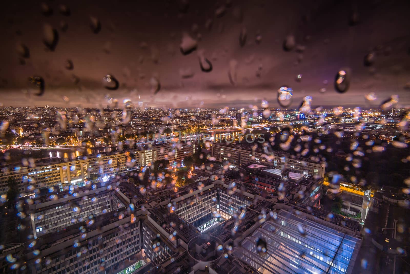 Paris city of lights at night when it's raining