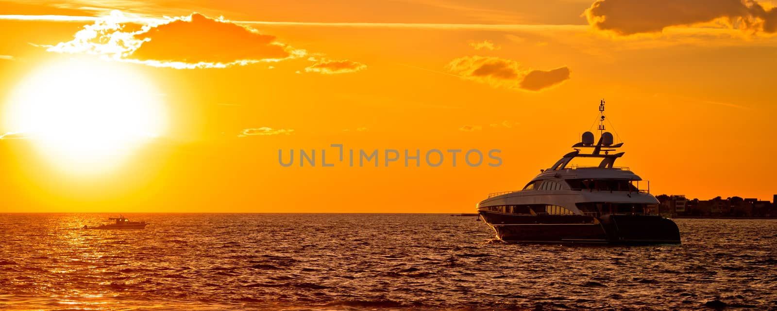 Yachtig on open sea at golden sunset panoramic view, Zadar, Dalmatia, Croatia