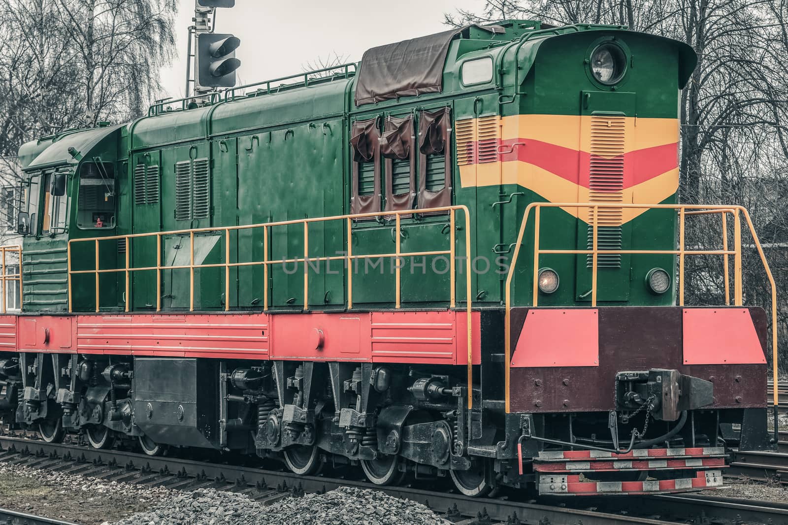 Green diesel cargo locomotive. Freight train in action