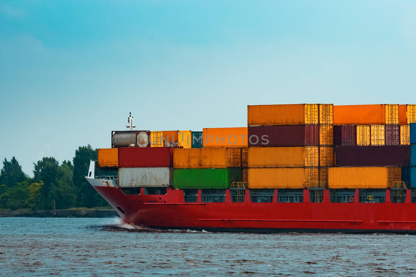 Red container ship underway by sengnsp