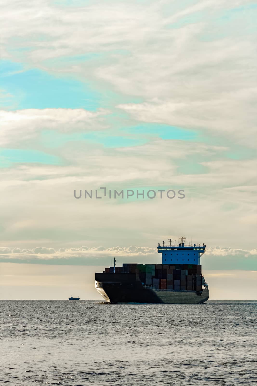 Black container ship underway by sengnsp