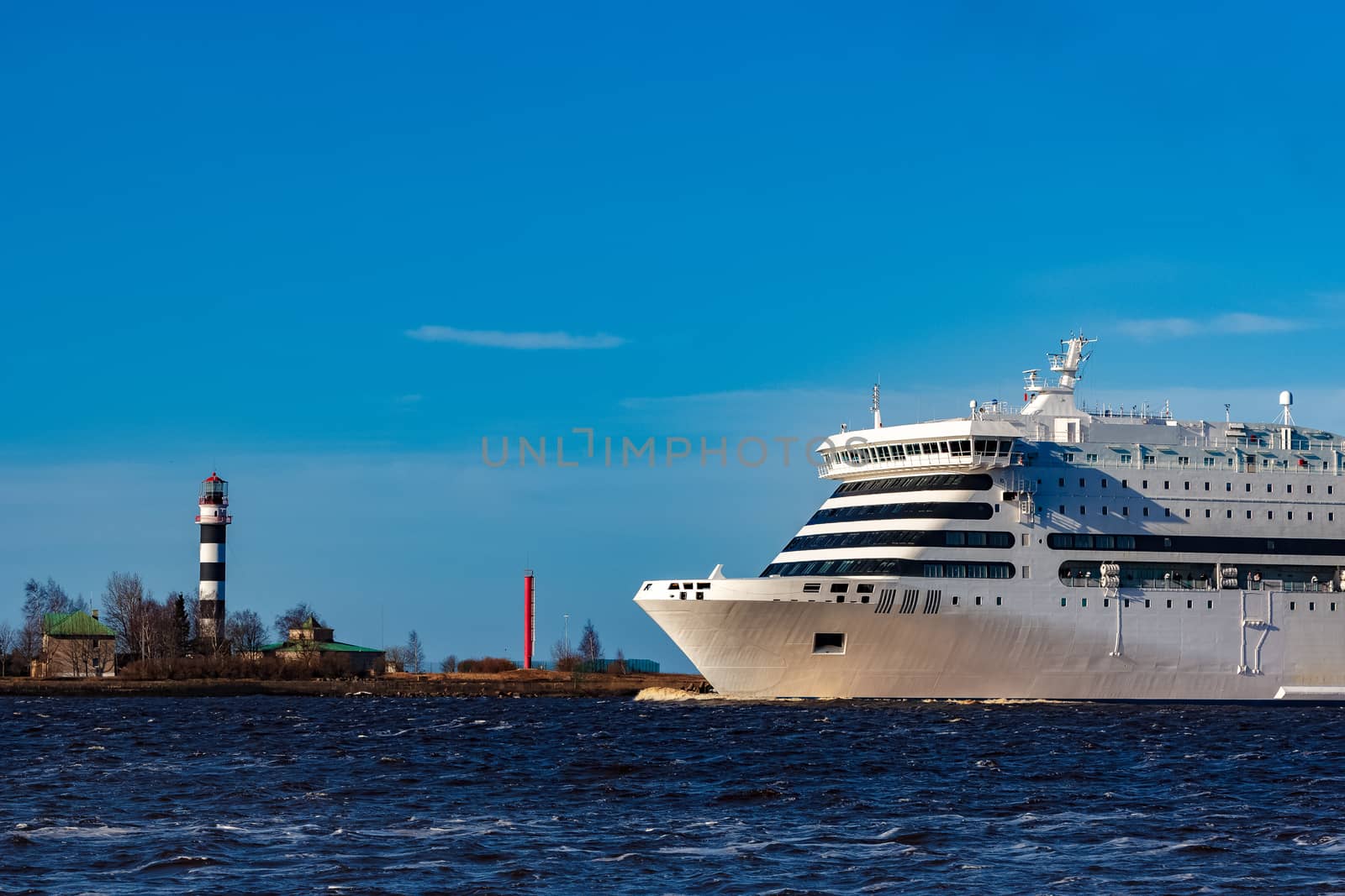 White cruise liner sailing on a clear day