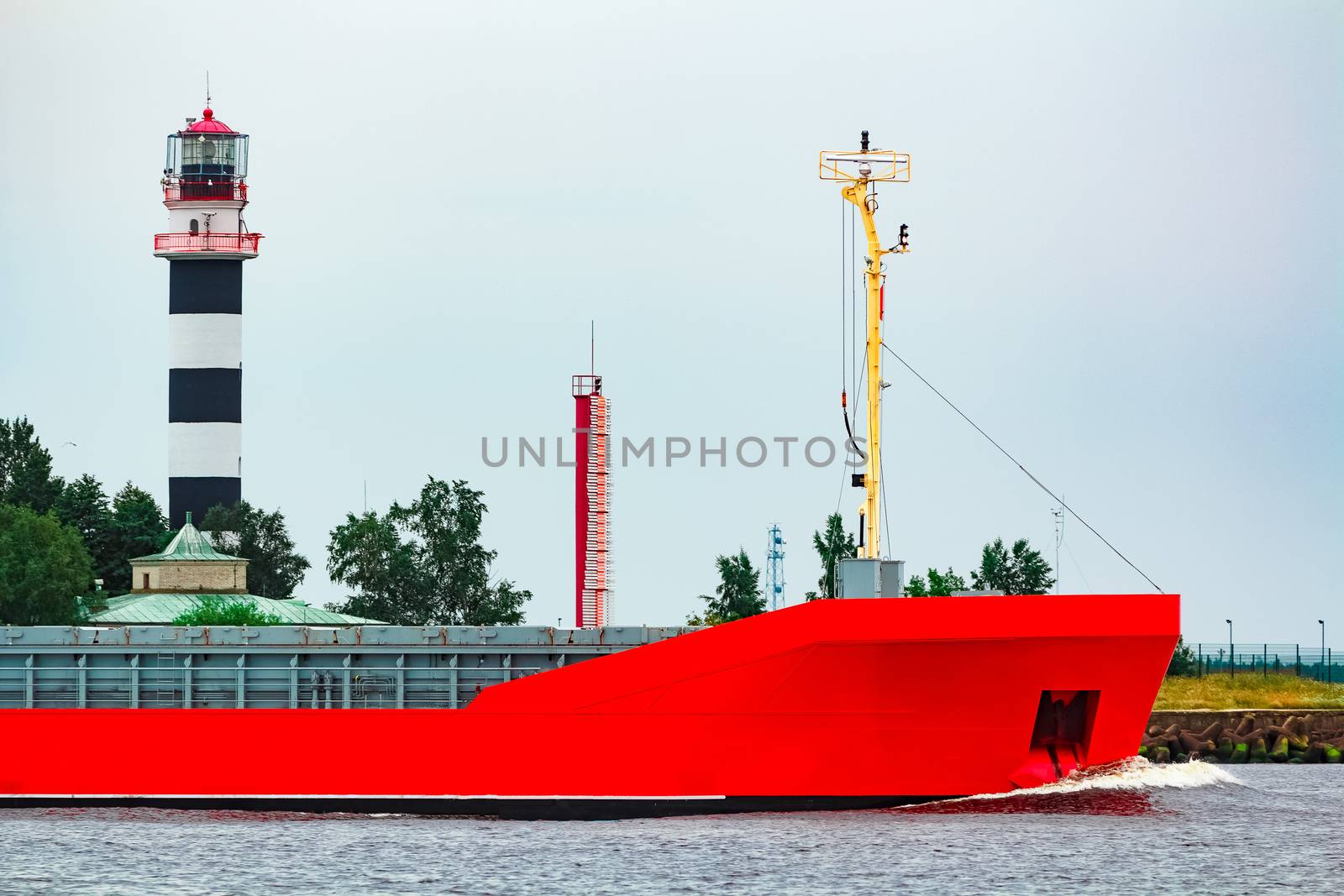 Orange cargo ship. Logistics and merchandise transportations