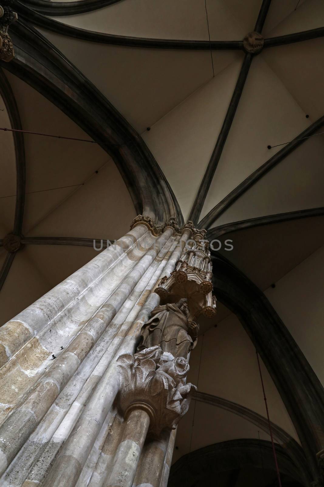 Low angle view of column and dome arch in famous Saint Stephen Cathedral (Stephansdom), the biggest cathedral and most important religious building in Vienna, Austria