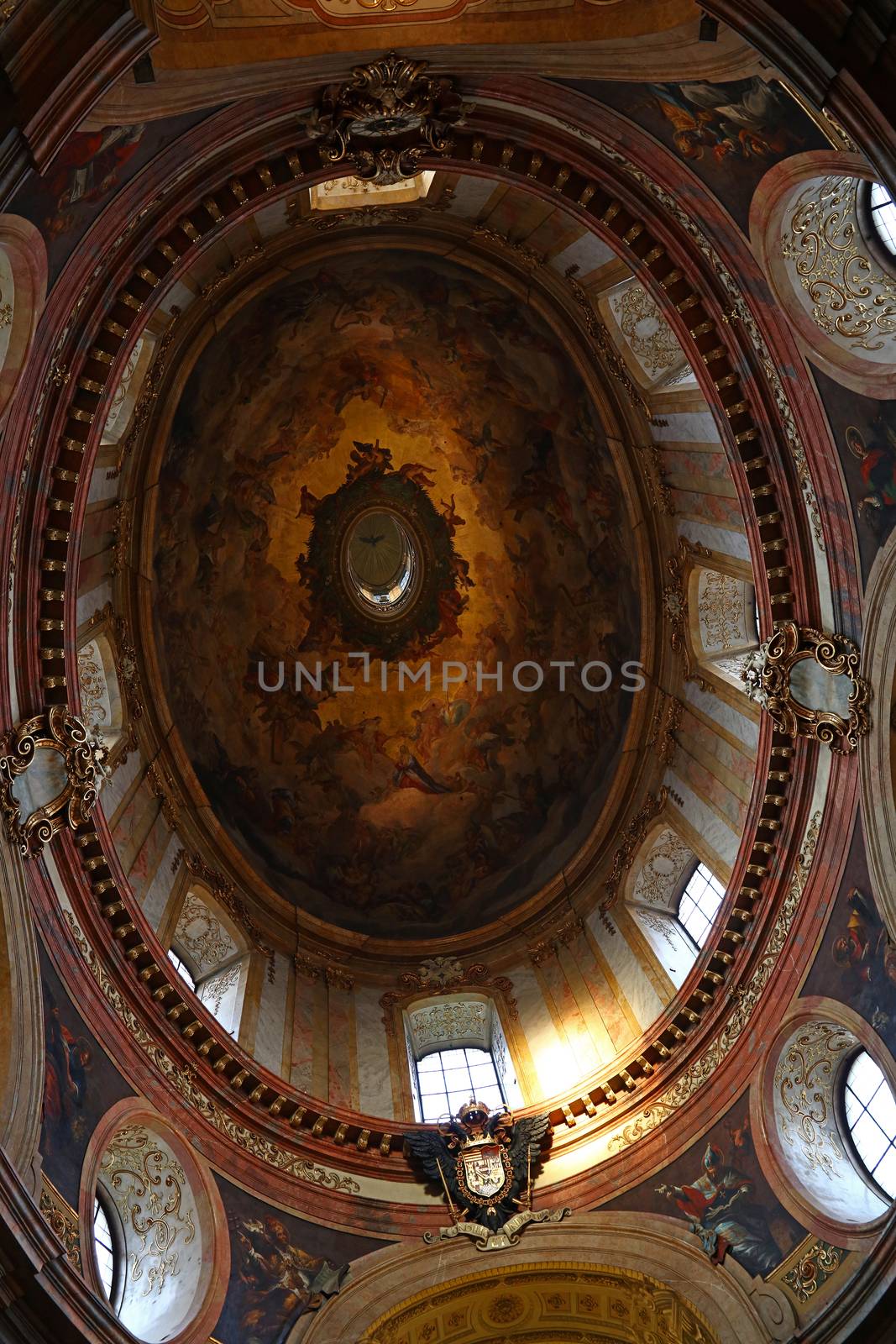 Low angle view of beautiful cupola with fresco of historic baroque church of Saintt Peter in Vienna, Austria
