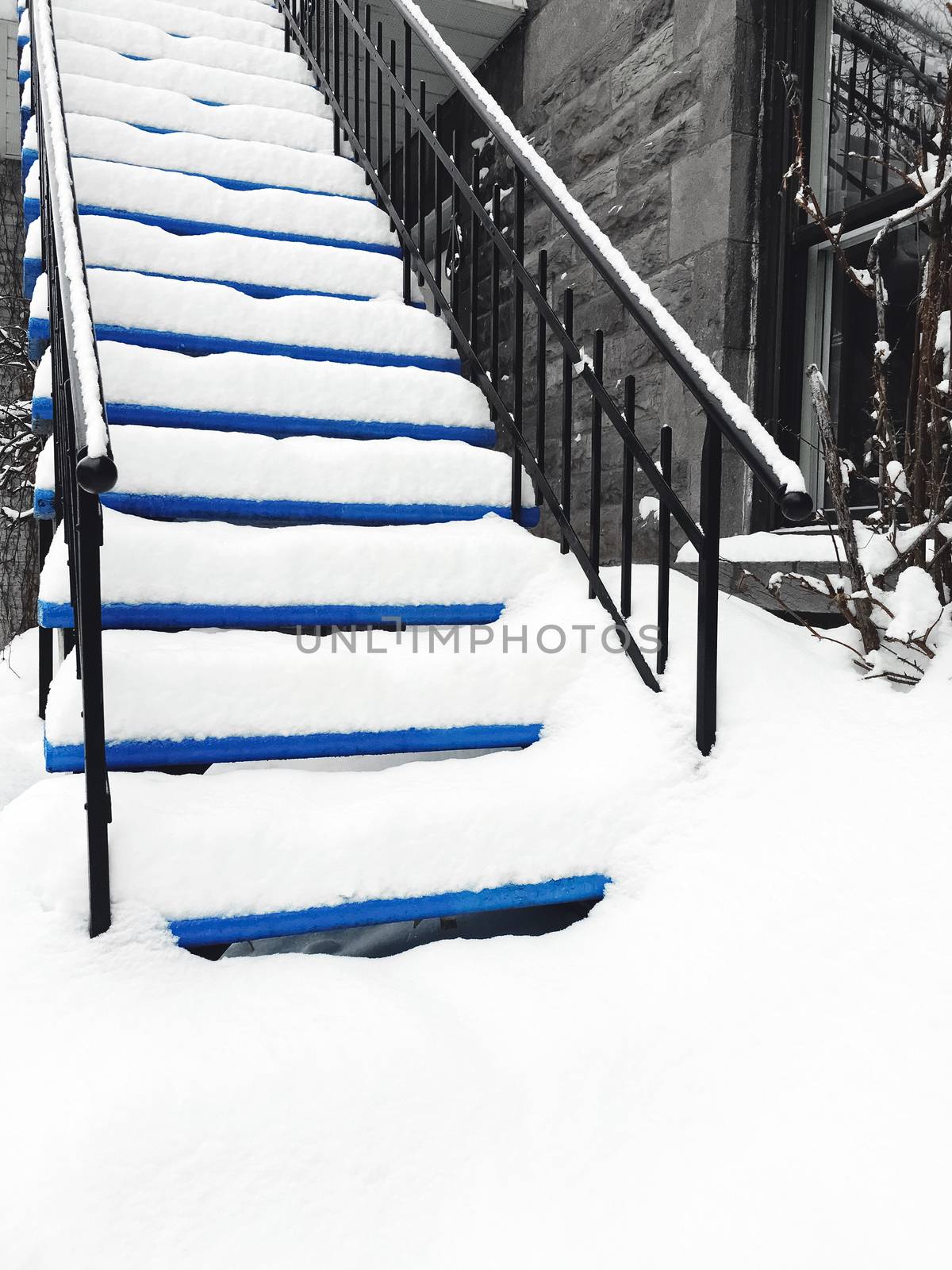Townhouse staircase covered in snow by anikasalsera